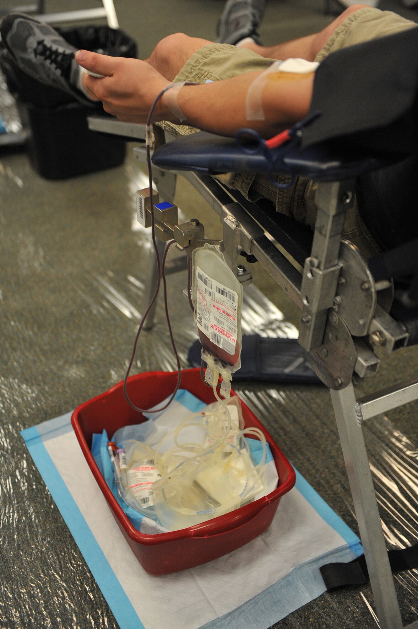 Airman 1st Class Matthew Mills, 723rd Aircraft Maintanence Squadron, donates blood during a blood drive at the base chapel here April 2. The American Red Cross organizes a blood drive on Moody every two months. (U.S. Air Force photo by Staff Sgt. Andrea Thacker/Released)