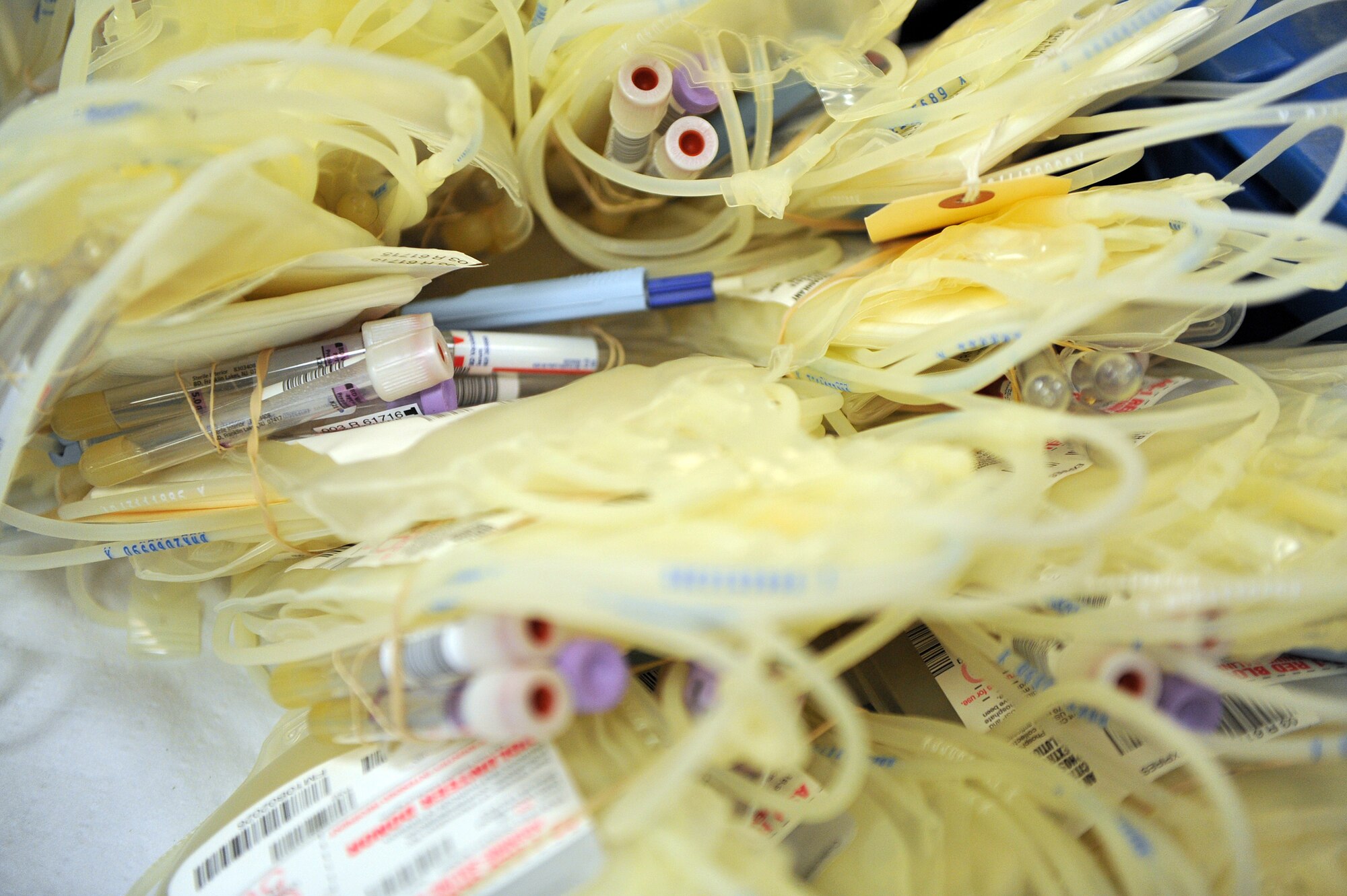Blood collection bag prepared by American Red Cross personnel sit waiting to be filled at the base chapel here April 2. According to the ARC, only three out of every 100 people in America donate blood. (U.S. Air Force photo by Staff Sgt. Andrea Thacker/Released) 