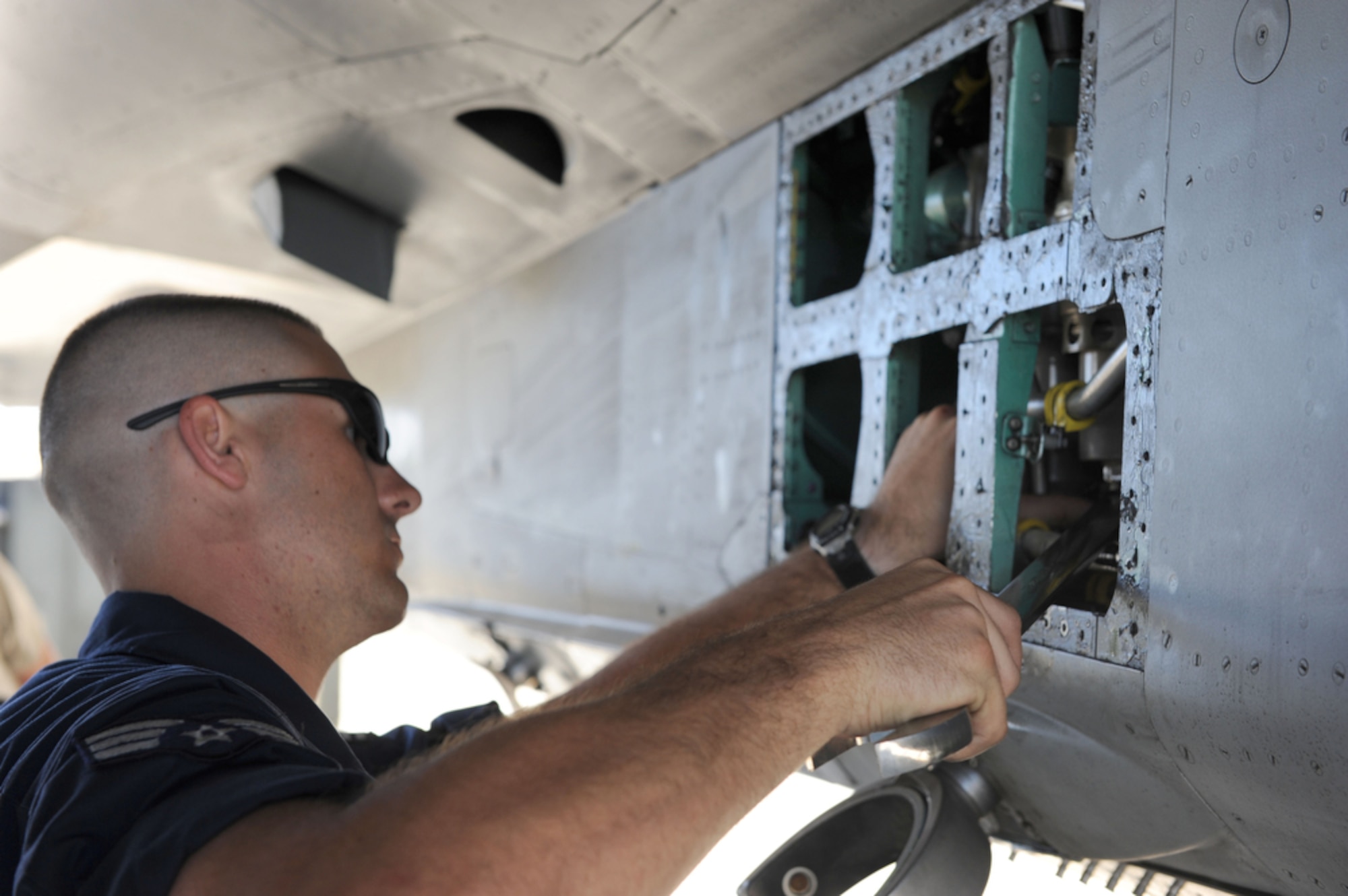 JOINT BASE PEARL HARBOR-HICKAM, Hawaii  - An F-15 crew chief, Senior Airman Dallion Griffin, assigned to the 19th Aircraft Maintenance Unit, 3rd Maintenance Squadron, Elmendorf Air Force Base, Alaska searches for the source of an oil leak on an F-15 while deployed to Joint Base Pearl Harbor-Hickam, Hawaii on March 23. (Air Force photo by Tech. Sgt. Cohen A. Young)