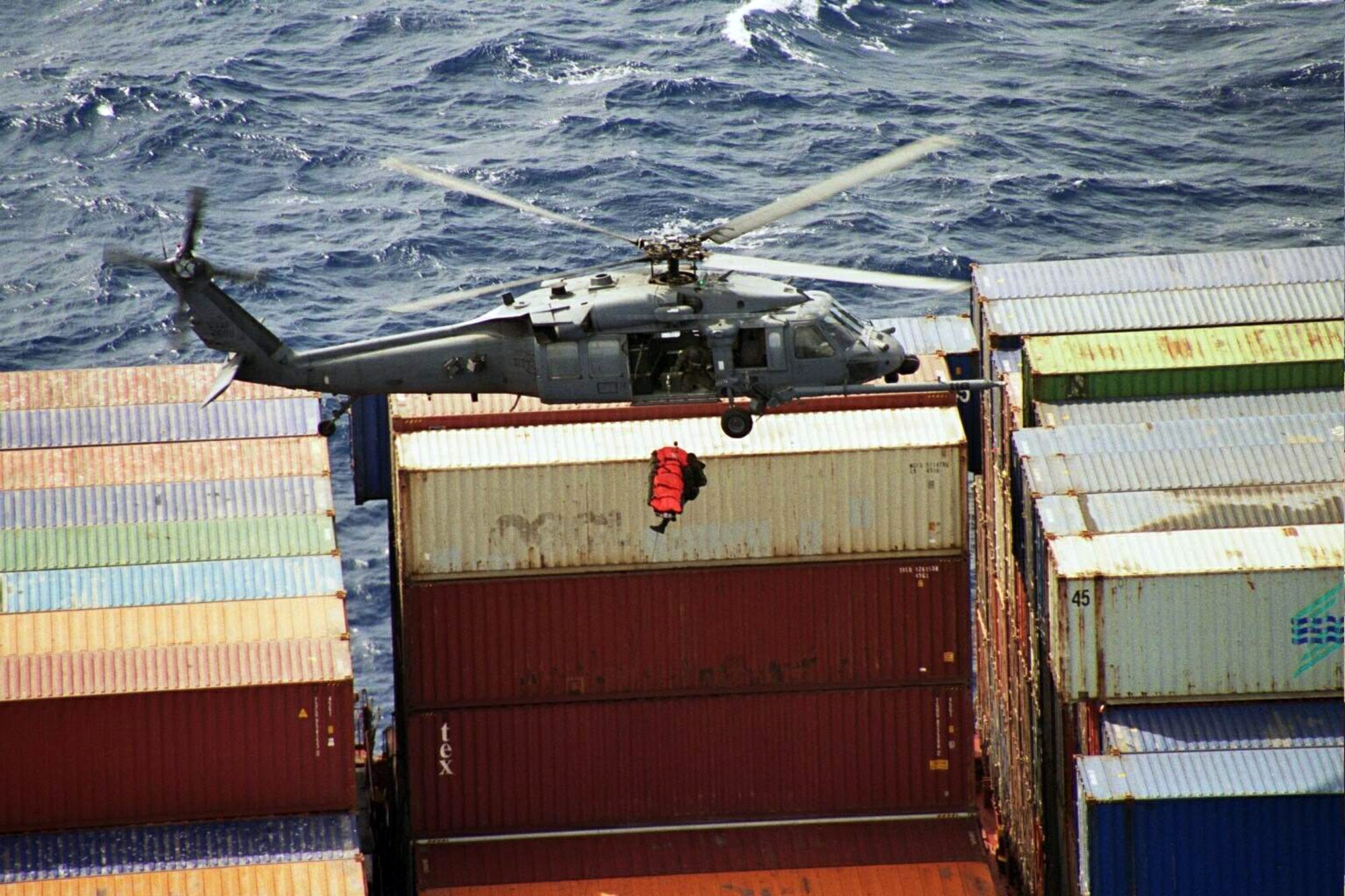 Pararescuemen from the 131st Rescue Squadron hoist a patient from a cargo container ship into a hovering HH60G Pave Hawk helicopter June 18, 2008. Airmen from the 129th Rescue Wing, based at Moffett Federal Airfield near San Francisco, helped rescue an injured passenger aboard a deep sea fishing vessel 1,400 miles off the coast of California March 31, 2010. (U.S. Air Force photo/Tech. Sgt. Brock Woodward)

