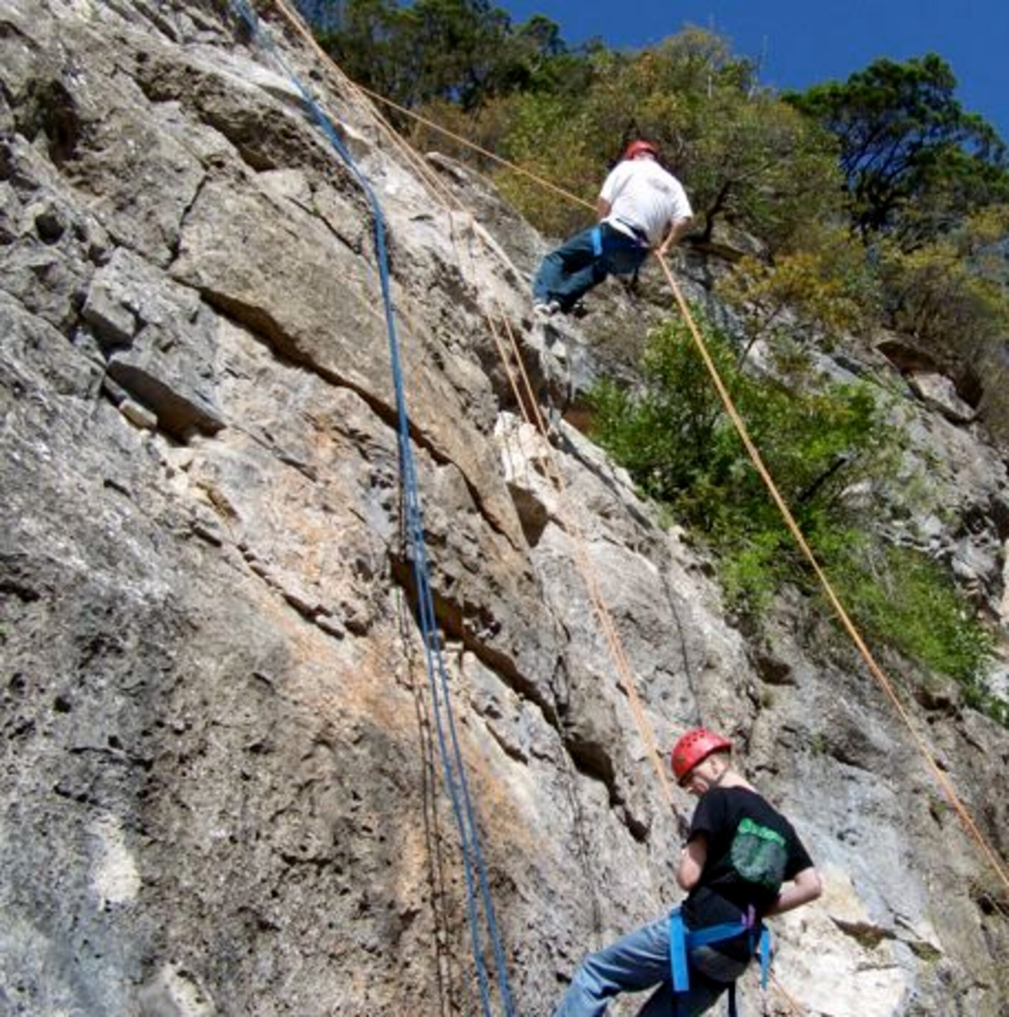 LAUGHLIN AIR FORCE BASE, Texas – Members of Laughlin’s junior enlisted corps rappel at Camp Eagle, located in the Texas Hill Country on the spring-fed Nueces River, during a weekend getaway sponsored by Laughlin’s base chapel recently. The Airmen also had the opportunity to ride an 800-foot zip line, rock climb and kayak. (contributed photo) 