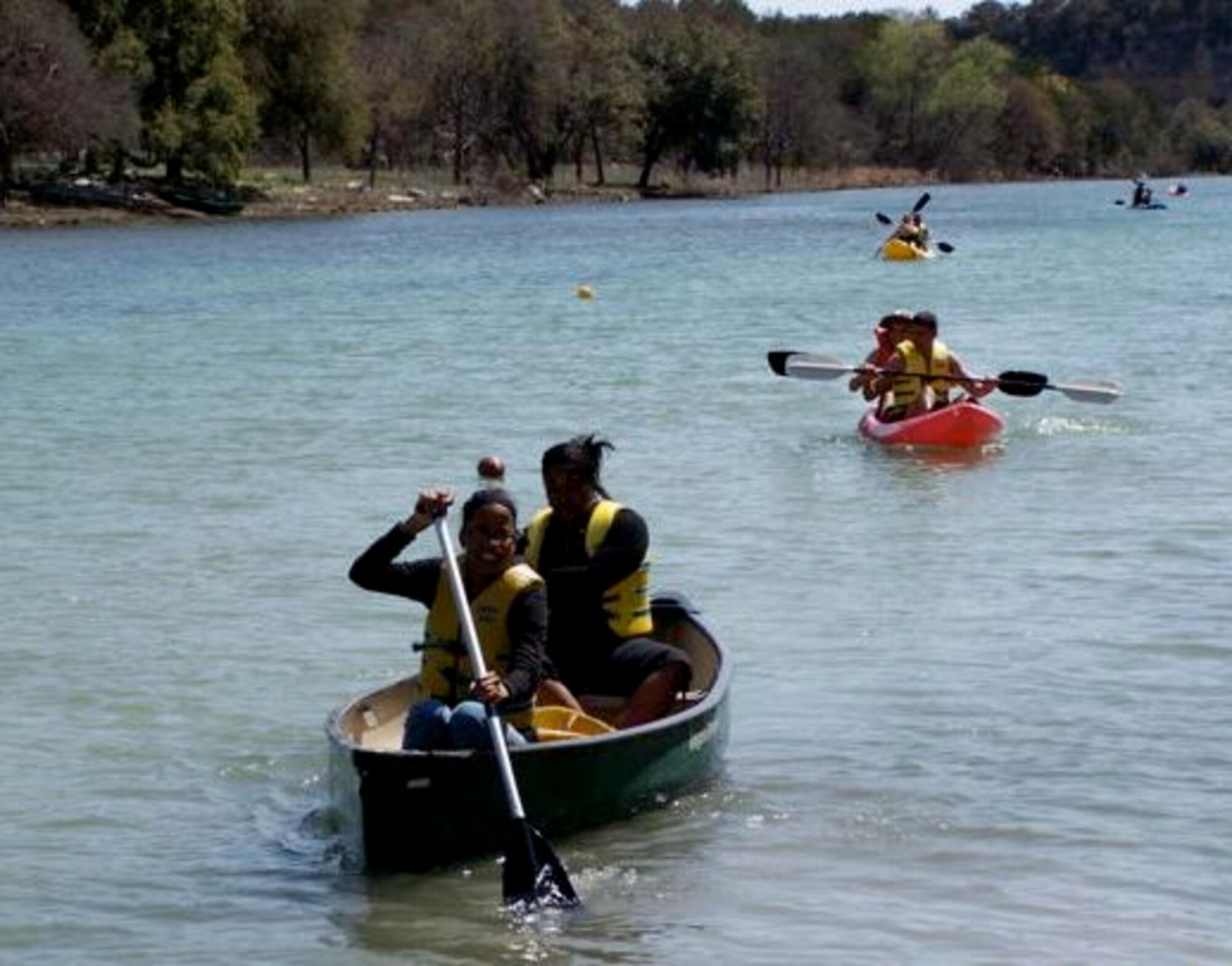 LAUGHLIN AIR FORCE BASE, Texas – Members of Laughlin’s junior enlisted corps kayak at Camp Eagle, located in the Texas Hill Country on the spring-fed Nueces River, during a weekend getaway sponsored by Laughlin’s base chapel recently. The Airmen also had the opportunity to ride an 800-foot zip line, rock climb and rappel. (contributed photo) 