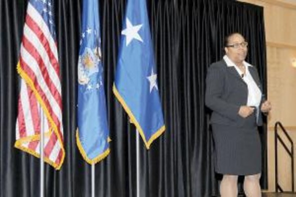 Adrienne Gillespie, coordinator of the Center for Diversity and Unity at Weber State University, addresses those gathered at the Federal Women's Program luncheon March 25. (Air Force photo by Kim Cook)