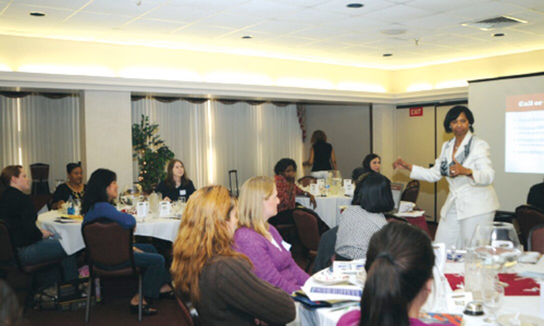 FORT EUSTIS, Va. -- Shirley Strong, Army Community Service mobilization and deployment specialist, listens to a question posed by a spouse at the first-ever “Married to the Army” seminar at the Fort Eustis Club Tuesday. The orientation provided newly-married and veteran spouses with information about programs, services and resources available through ACS and other providers. (U.S. Army photo/Lyna Tucker)