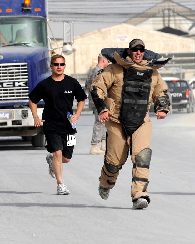 Air Force and Navy explosive ordnance disposal participants ran the 10K race wearing a 70-pound military bomb suit March 21, 2010, at Kandahar Airfield, Afghanistan. The event raised more than $9,000 for the Wounded Explosive Ordnance Disposal Warrior Foundation. (U.S. Air Force photo/Senior Airman Nancy Hooks)