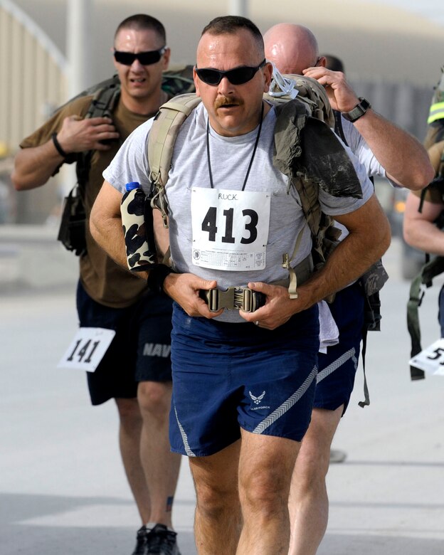 Servicemembers participate in a fundraiser March 21, 2010, at Kandahar Airfield, Afghanistan. Members chose one of three ways to participate: a five kilometer run, a 10-kilometer run or a biathlon that consisted of a 5K run followed by another 5K run with a 35-pound ruck sack strapped to their backs. (U.S. Air Force photo/Senior Airman Nancy Hooks)