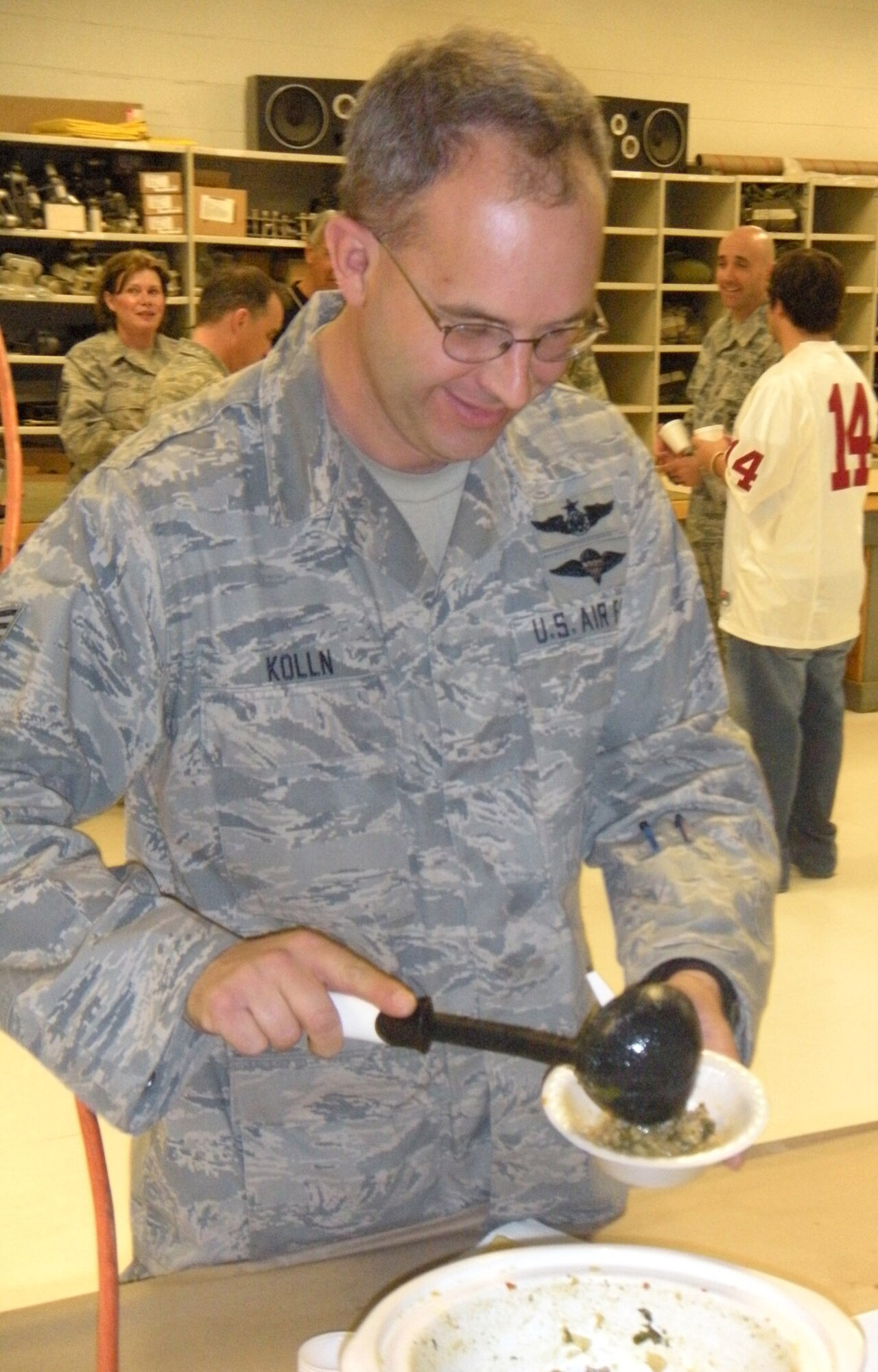 Tech. Sgt. Kevin Kolln, 39th Aerial Port Squadron loadmaster, takes on a serving of chili April 1 during the annual 302nd Airlift Wing chili cookoff event at Peterson Air Force Base, Colo. Located in the 39th APS building, 18 competitors submitted their green or red chili creations for either a first, second or third place award recognition of "best chili" in their category. For the green chili category: 1st, Master Sgt. David Robbin; 2nd, Senior Master Sgt. Dean Firestein; and 3rd, Mrs. Katie Davidson. For the red chili category: 1st, Master Sgt. Pam Scharfenberg; 2nd, Master Sgt. Richele Beckett; and 3rd, Mr. Russell Dunlap. (U.S. Air Force photo/Staff Sgt. Stephen J. Collier)