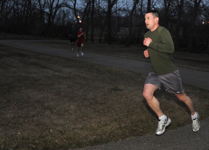 2nd Lt. Benjamin Germano, 319th Comptroller Squadron, participates in a 5K fun-run April 1 on Grand Forks Air Force Base, N.D. The fun-run was held on April Fool’s Day as a way to increase morale and esprit-de-corp. (U.S. Air Force photo by Airman 1st Class Amber Price)