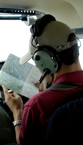 Jeff Lawson reviews a map on a Cessna-172 during a round-trip, touch-and-go flight from Joint Base Charleston, S.C., to Savannah, Ga., March 25, 2010. Mr. Lawson, assistant chief flight instructor with the Aero Club, has been flying nearly five years total and three with the Aero Club. (U.S. Air Force Photo/Airman 1st Class Lauren Main)