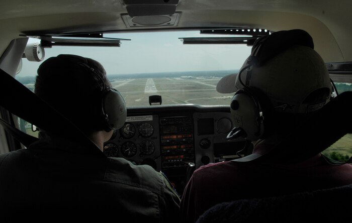 U.S. Air Force Staff Sgt. Jared Lambert, left, and Jeff Lawson prepare for landing as they approach the runway at Savannah International Airport, Ga., March 25, 2010. Sergeant Lambert has been flying all of his life and is currently earning his commercial pilot license to prepare for a career outside of the Air Force. Mr. Lawson is a flight instructor who has been flying nearly five years in all and three with the Aero Club, and Sergeant Lambert is a loadmaster with the 437th Operations Support Squadron. (U.S. Air Force Photo/Airman 1st Class Lauren Main)