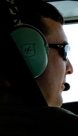 U.S. Air Force Staff Sgt. Jared Lambert radios the control tower in Savannah, Ga., during a touch-and-go flight from Joint Base Charleston, S.C., March 25, 2010. The flight was one of the remaining few Sergeant Lambert must complete before receiving his commercial pilot license. Once his enlistment ends in early spring, Sergeant Lambert is moving back to Texas to take over his family's crop dusting business and said, "I will definitely miss being in the Air Force. The Air Force has been nothing but great to me. I am in no way obligated to get out and go home. This is a job I have wanted to do since I was a little boy on my dad's farm, watching my cousin spray our crops. It will hopefully be a dream come true." Sergeant Lambert is a loadmaster with the 437th Operations Support Squadron. (U.S. Air Force Photo/Airman 1st Class Lauren Main)