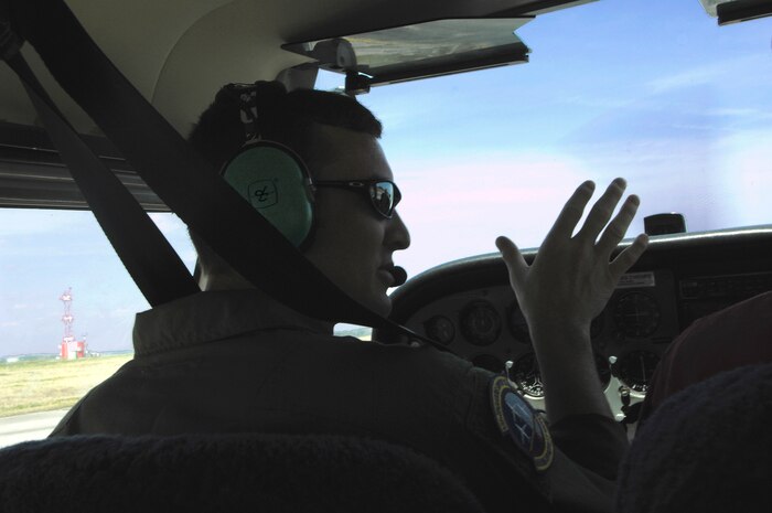 U.S. Air Force Staff Sgt. Jared Lambert speaks to his instructor on a Cessna-172 at the Aero Club on Joint Base Charleston, S.C., March 25, 2010. Sergeant Lambert has been flying since September 2007 with the Aero Club, but grew up flying with his Dad, who was also a pilot. Sergeant Lambert is a loadmaster with the 437th Operations Support Squadron. (U.S. Air Force photo/Airman 1st Class Lauren Main)