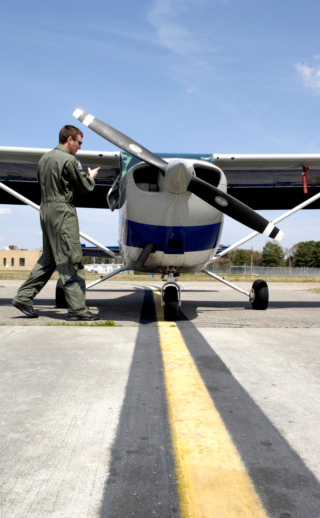 U.S. Air Force Staff Sgt. Jared Lambert performs a pre-flight inspection on a Cessna-172 at the Aero Club on Joint Base Charleston, S.C., March 25, 2010. Sergeant Lambert has almost completed the remaining 20 hours needed to earn his commercial pilot license. Once his enlistment ends in early spring, he plans to move back to Texas and take over his family's crop dusting business. Sergeant Lambert is a loadmaster with the 437th Operations Support Squadron. (U.S. Air Force photo/Airman 1st Class Lauren Main)