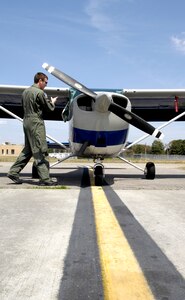 U.S. Air Force Staff Sgt. Jared Lambert performs a pre-flight inspection on a Cessna-172 at the Aero Club on Joint Base Charleston, S.C., March 25, 2010. Sergeant Lambert has almost completed the remaining 20 hours needed to earn his commercial pilot license. Once his enlistment ends in early spring, he plans to move back to Texas and take over his family's crop dusting business. Sergeant Lambert is a loadmaster with the 437th Operations Support Squadron. (U.S. Air Force photo/Airman 1st Class Lauren Main)