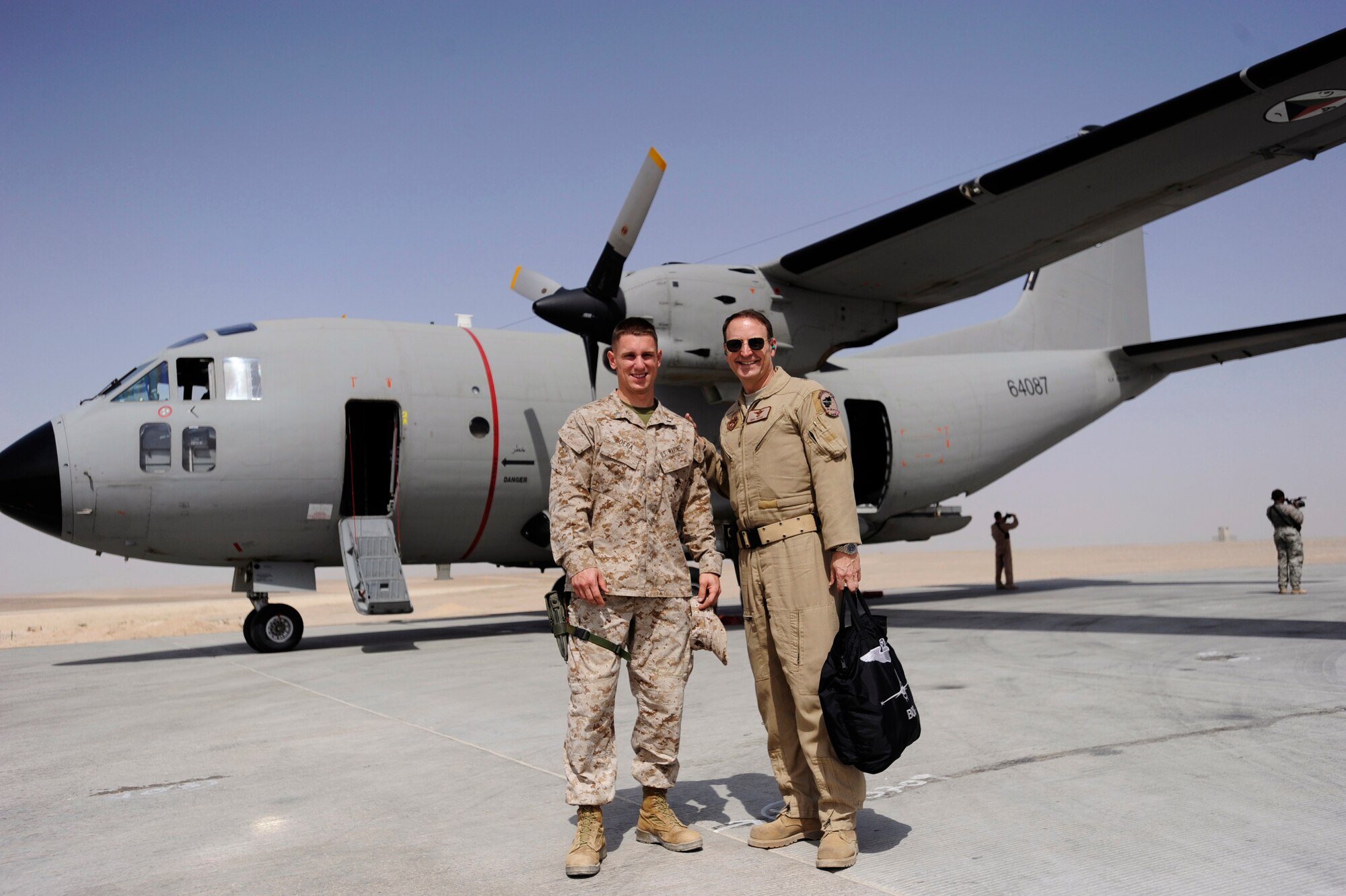 Marine First Lt. Benjamin Boera, (left) 5th Battalion 11th Marines High Mobility Artillery Rocket System Tango Battery platoon commander, and his dad, Brig. Gen. Michael Boera, 438th Air Expeditionary Wing and Combined Air Power Transition Force commander, pose for a photo in front of a C-27A Spartan cargo plane the general was flying March 28, 2010, at Camp Bastian, Afghanistan. (U.S. Air Force photo/Staff Sgt. Manuel J. Martinez/released)
