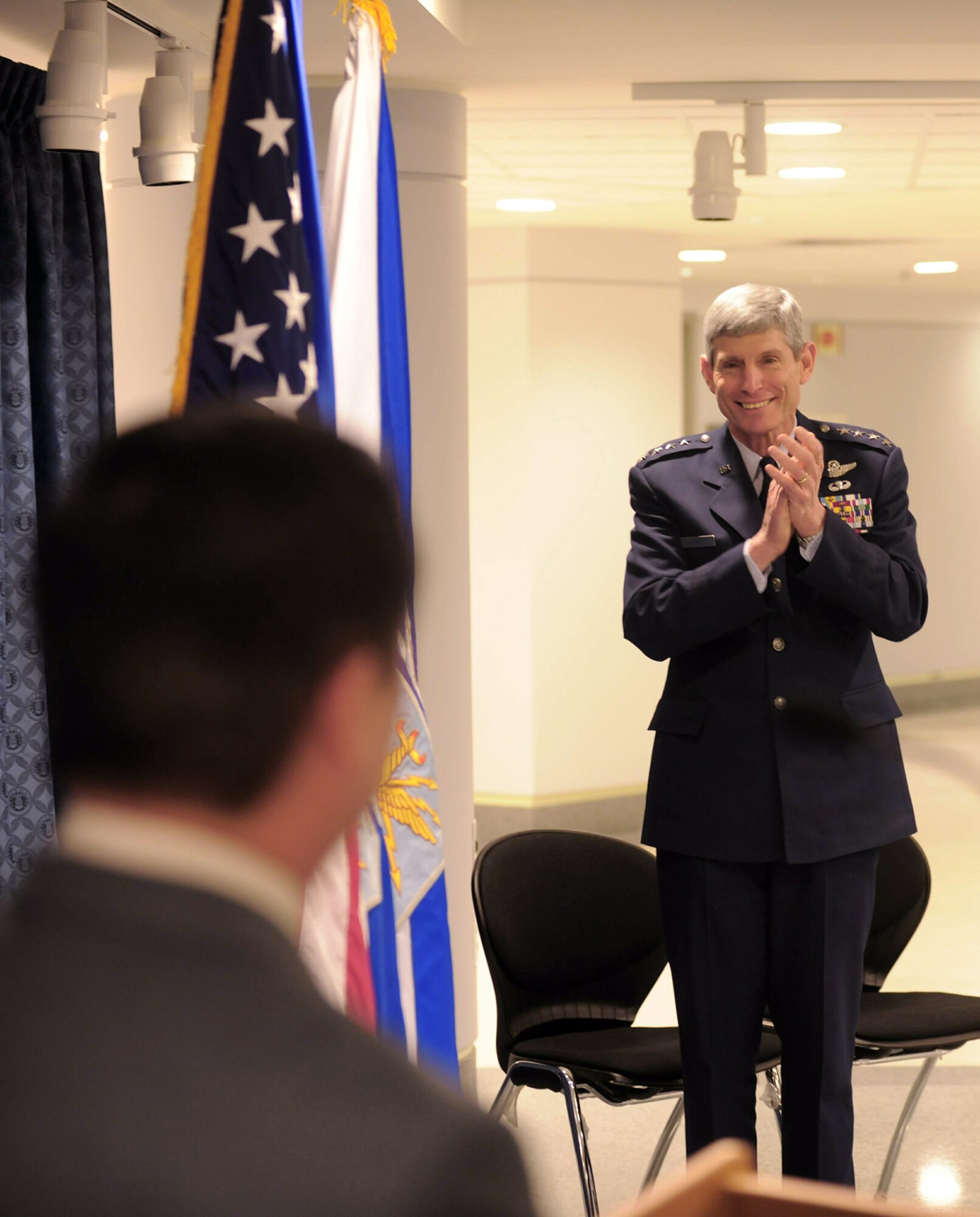 Air Force Chief of Staff Gen. Norton Schwartz leads the applause for Yia Kha after he addresses the crowd attending his recognition ceremony March 30, 2010, in the Pentagon. Mr. Kha received a certificate of recognition from the Air Force to acknowledge his seven years of service supporting combat operations in Vietnam. Mr. Kha was a Hmong soldier who trained to be 'Robin', backseat aircrews who supported U.S. forward air controllers. (U.S. Air Force photo)