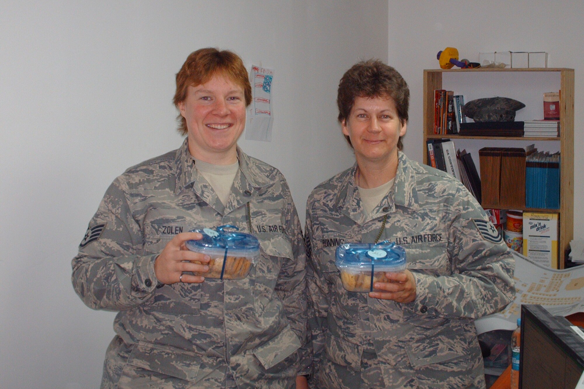 148th Fighter Wing Civil Engineer members from Duluth, Minn., stationed at Bagram Air Field, Afghanistan, proudly show off the cookies they have received from the Cookie Brigade March 2010.