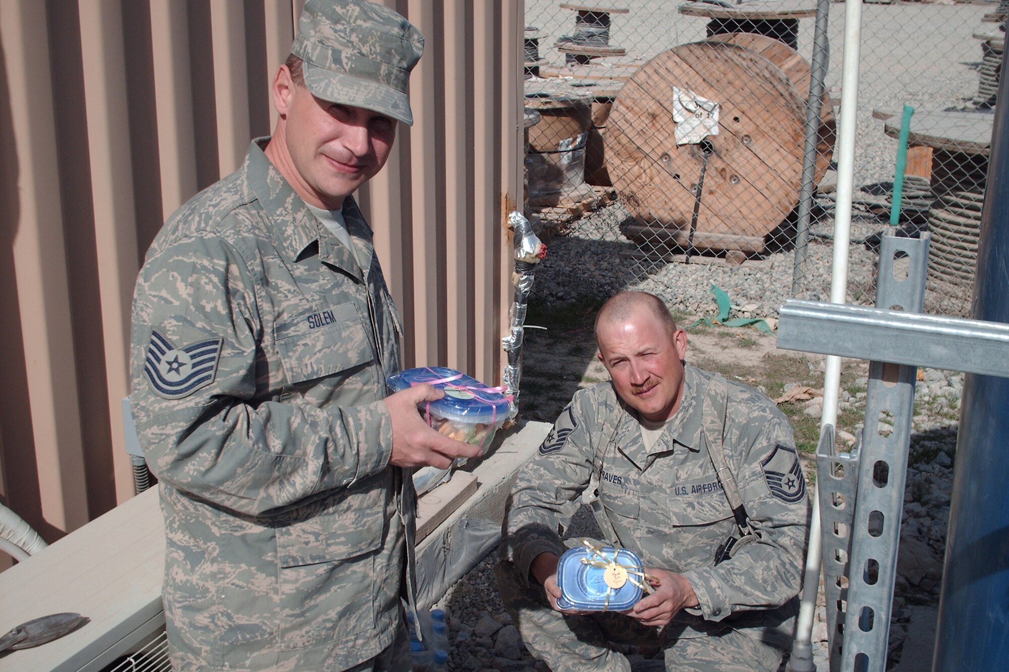 148th Fighter Wing Civil Engineer members from Duluth, Minn., stationed at Bagram Air Field, Afghanistan, proudly show off the cookies they have received from the Cookie Brigade March 2010.