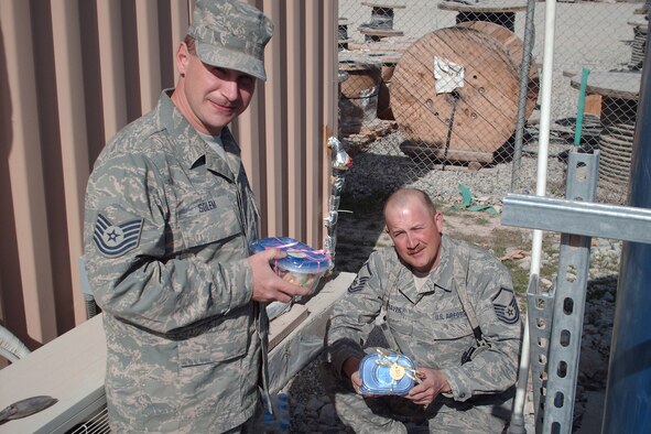 148th Fighter Wing Civil Engineer members from Duluth, Minn., stationed at Bagram Air Field, Afghanistan, proudly show off the cookies they have received from the Cookie Brigade March 2010.