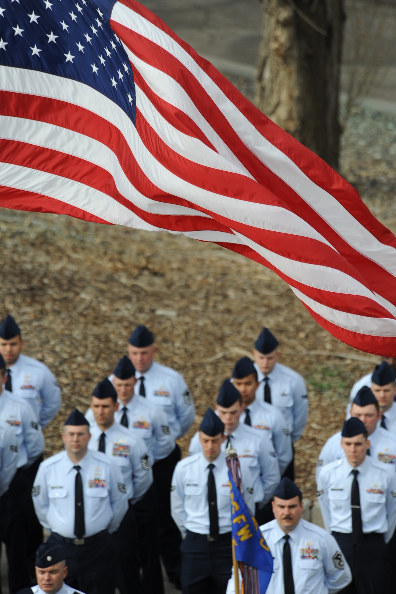 MOUNTAIN HOME AIR FORCE BASE, Idaho -- Airmen from the 366th Civil Engineering Squadron are in formation before the flag is lowered during a retreat ceremony at the 366th Fighter Wing Headquarters March 29. 366th CES hosted the retreat in memory of Tech. Sgt. Walt Moss, 366th CES explosive ordnance disposal apprentice. Sergeant Moss was the first United States Air Force EOD Airman to be killed in combat since the start of OEF and OIF, and was killed near Baghdad during safing operations. (U.S. Air Force photo by Airman 1st Class Renishia Richardson)