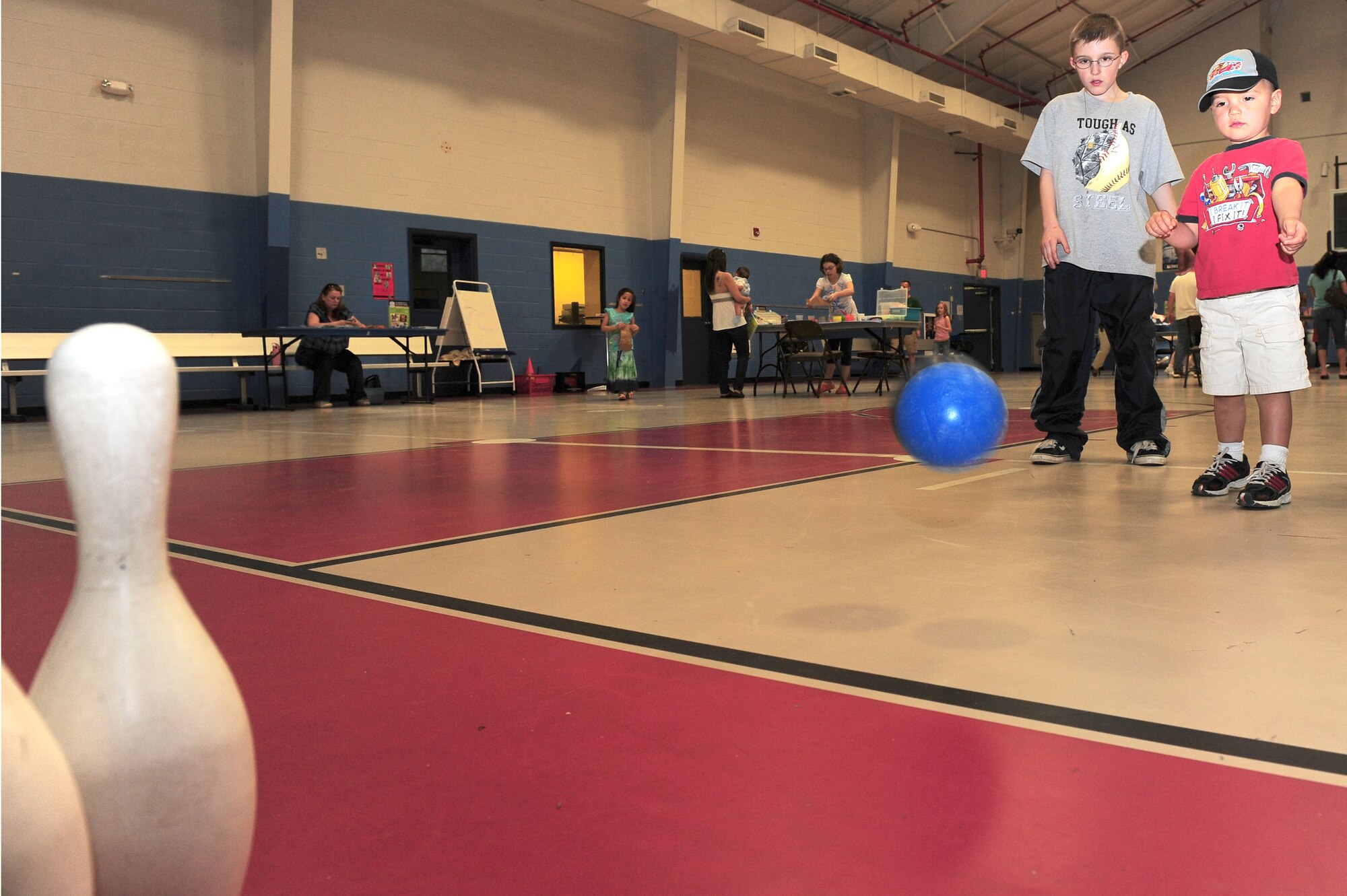SHAW AIR FORCE BASE, S.C. -- Pablo Juarez, son of Captain Pablo Juarez, Air Force Central Command, throws the ball toward the bowling pins during the Month of the Military Child carnival here April 1. (U.S Air Force photo/Senior Airman David Minor)