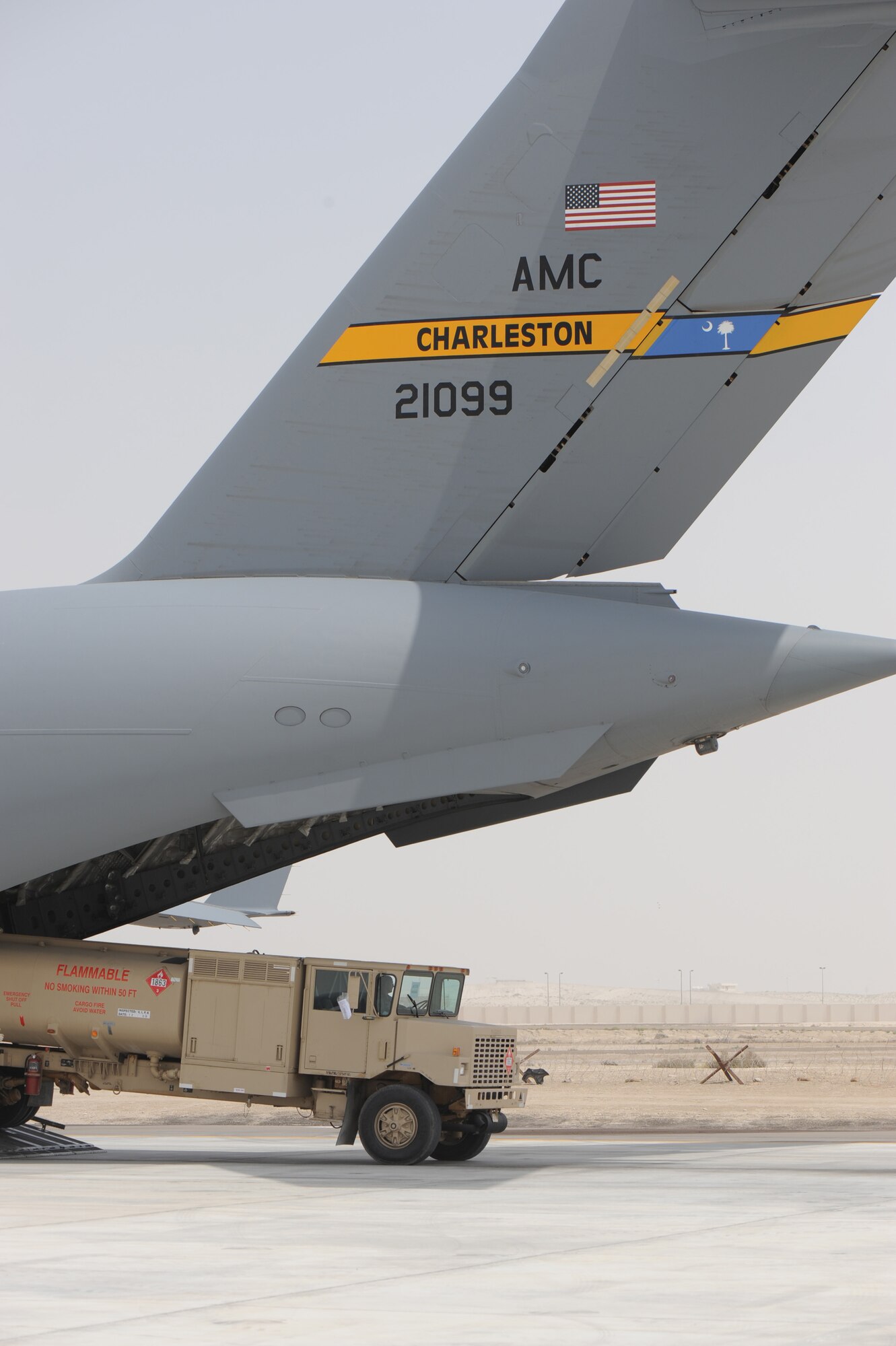 Airmen unload an R-11 fuels truck from a C-17 Globemaster III from Joint Base Charleston, S.C., during operations for the 380th Air Expeditionary Wing at a non-disclosed base in Southwest Asia on March 27, 2010. The C-17 stopped to deliver R-11 fuels trucks and pick-up other cargo as part of overseas contingency operations in the U.S. Central Command area of responsibility. The 380th AEW is home to the KC-10 Extender, U-2 Dragon Lady, E-3 Sentry and RQ-4 Global Hawk aircraft. The wing is comprised of four groups and 12 squadrons and the wing's deployed mission includes air refueling, surveillance and reconnaissance in support of overseas contingency operations in Southwest Asia. The 380th AEW supports operations Iraqi Freedom and Enduring Freedom and the Combined Joint Task Force-Horn of Africa. (U.S. Air Force Photo/Master Sgt. Scott T. Sturkol/Released)