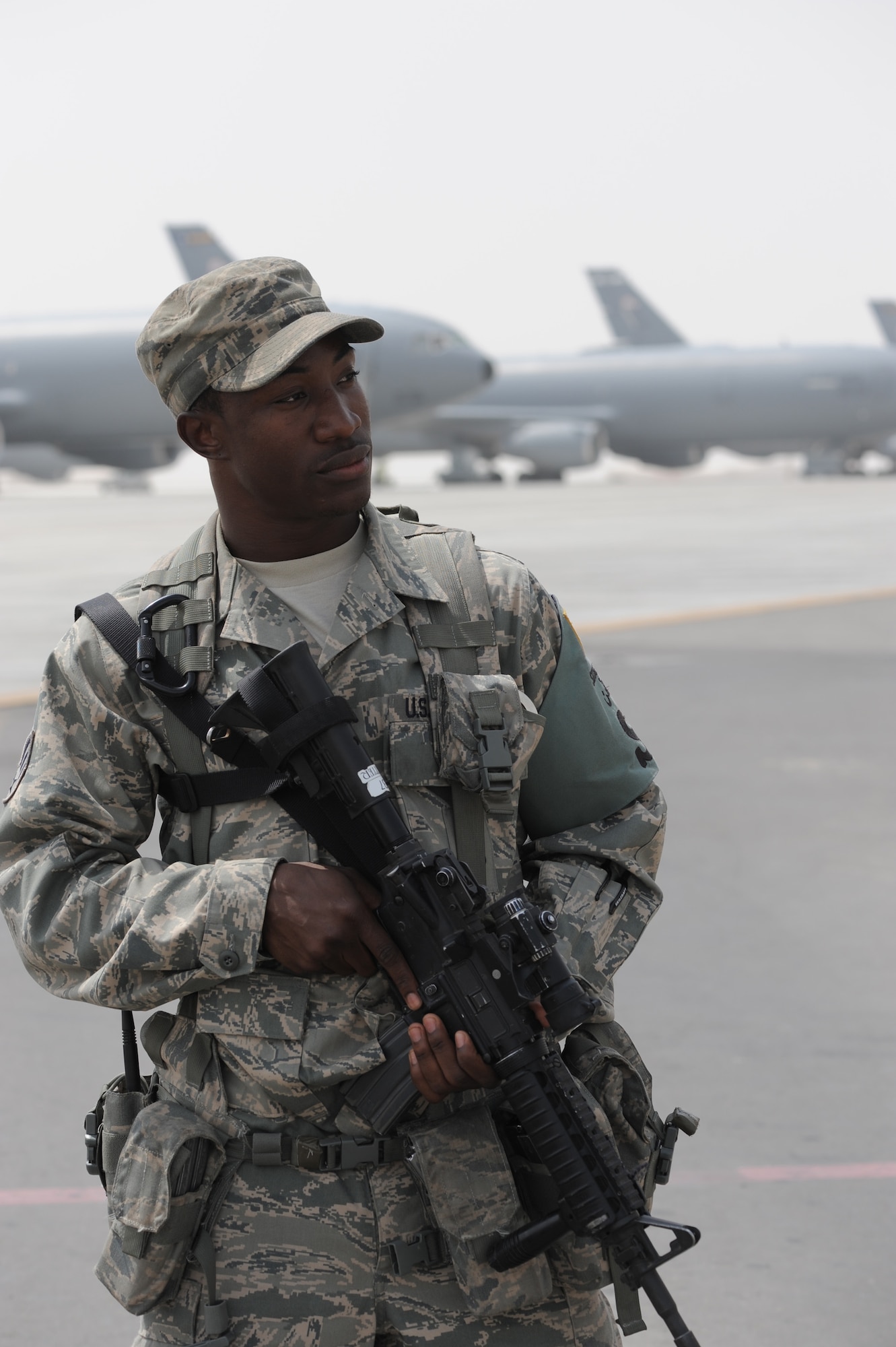 Senior Airman Michael Better, security forces journeyman with the 380th Expeditionary Security Forces Squadron, watches over a checkpoint near the flightline at a non-disclosed base in Southwest Asia on March 27, 2010. As a security forces Airman, Airman Better supports all security and force protection efforts for a deployed wing of more than 1,900 people and for billions of dollars worth of Air Force equipment and assets. He is deployed from the 628th Security Forces Squadron at Joint Base Charleston, S.C., and his hometown is Baltimore City, Md. (U.S. Air Force Photo/Master Sgt. Scott T. Sturkol/Released) 