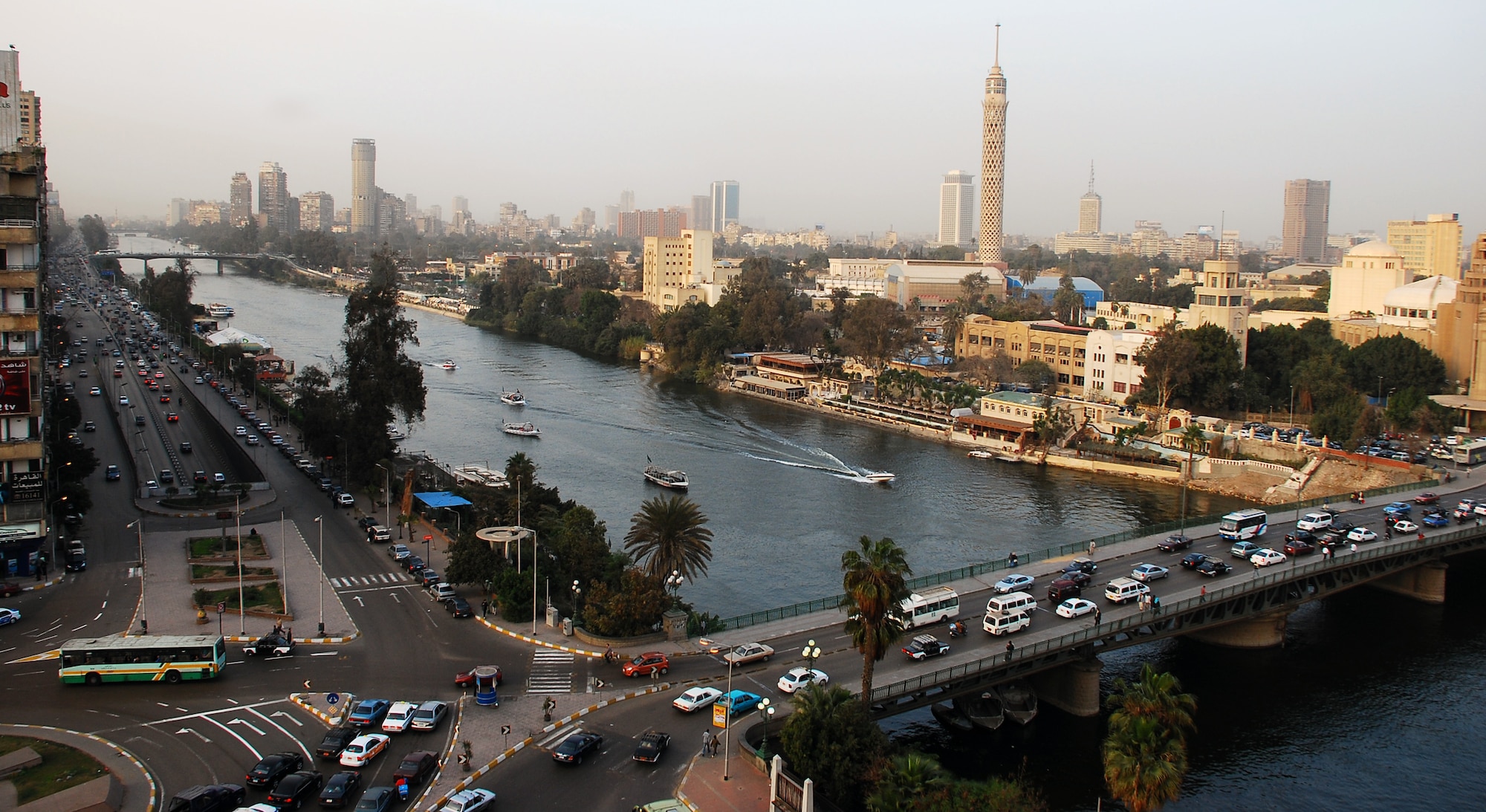 Cars crisscross through the inner city of Cairo Egypt, alongside the Nile River during the day.  Cairo is the capital of Egypt and the largest city in Africa as well as one of the most densely populated cities in the world. Cairo is the center of the region’s political and cultural life and is largely associated with Ancient Egypt due to the proximity of the Great Sphinx and the Pyramids of Giza. (U.S. Air Force photo/Senior Airman Sara Csurilla)