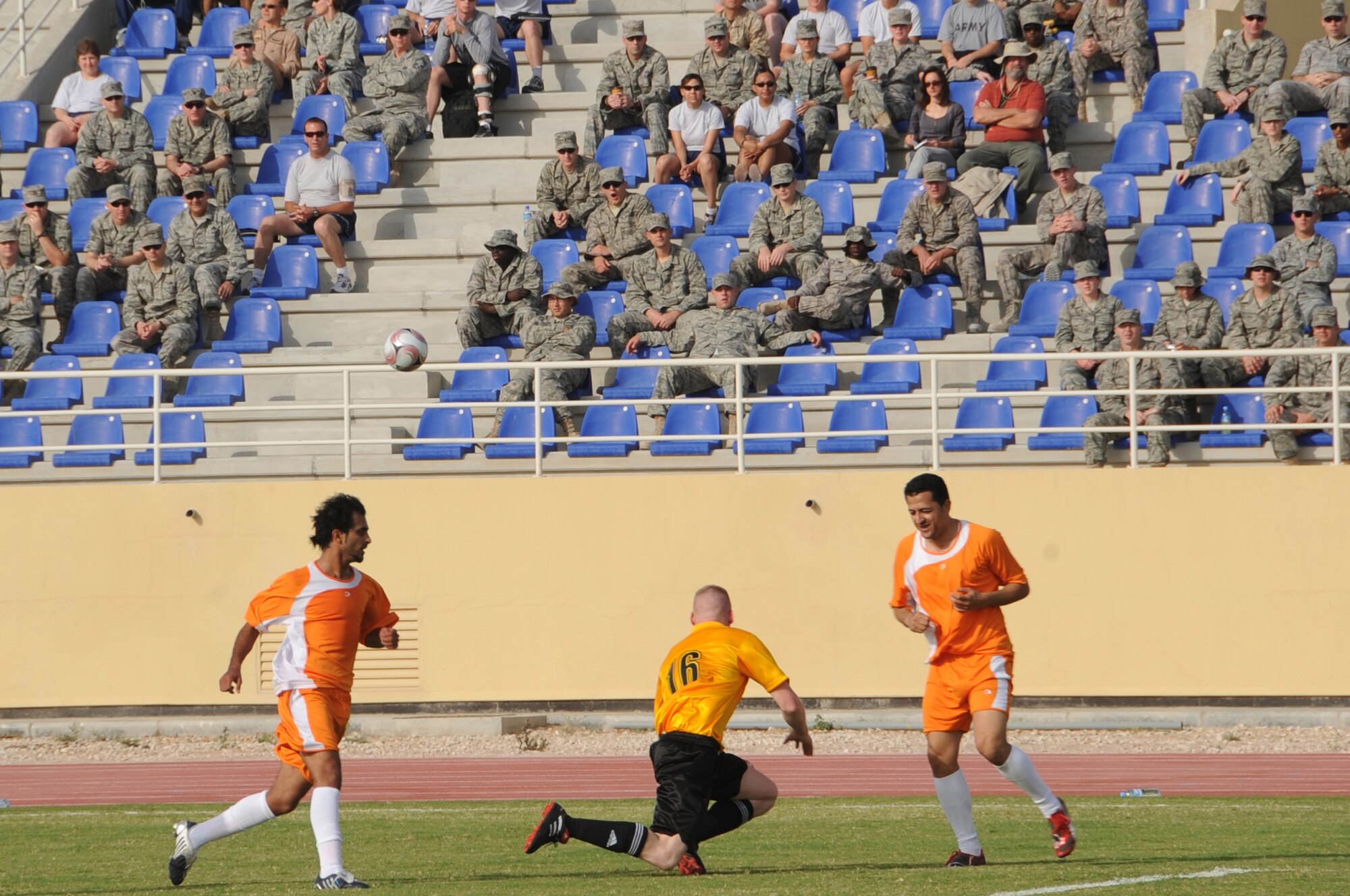 Host-nation and Coalition servicemembers compete in a high-speed game of soccer at a non-disclosed Southwest Asia location, April 1, 2010. The host-nation team defeated the Coalition forces team by a score of 3-1. (U.S. Air Force photo by Tech. Sgt. Michelle Larche)[RELEASED]