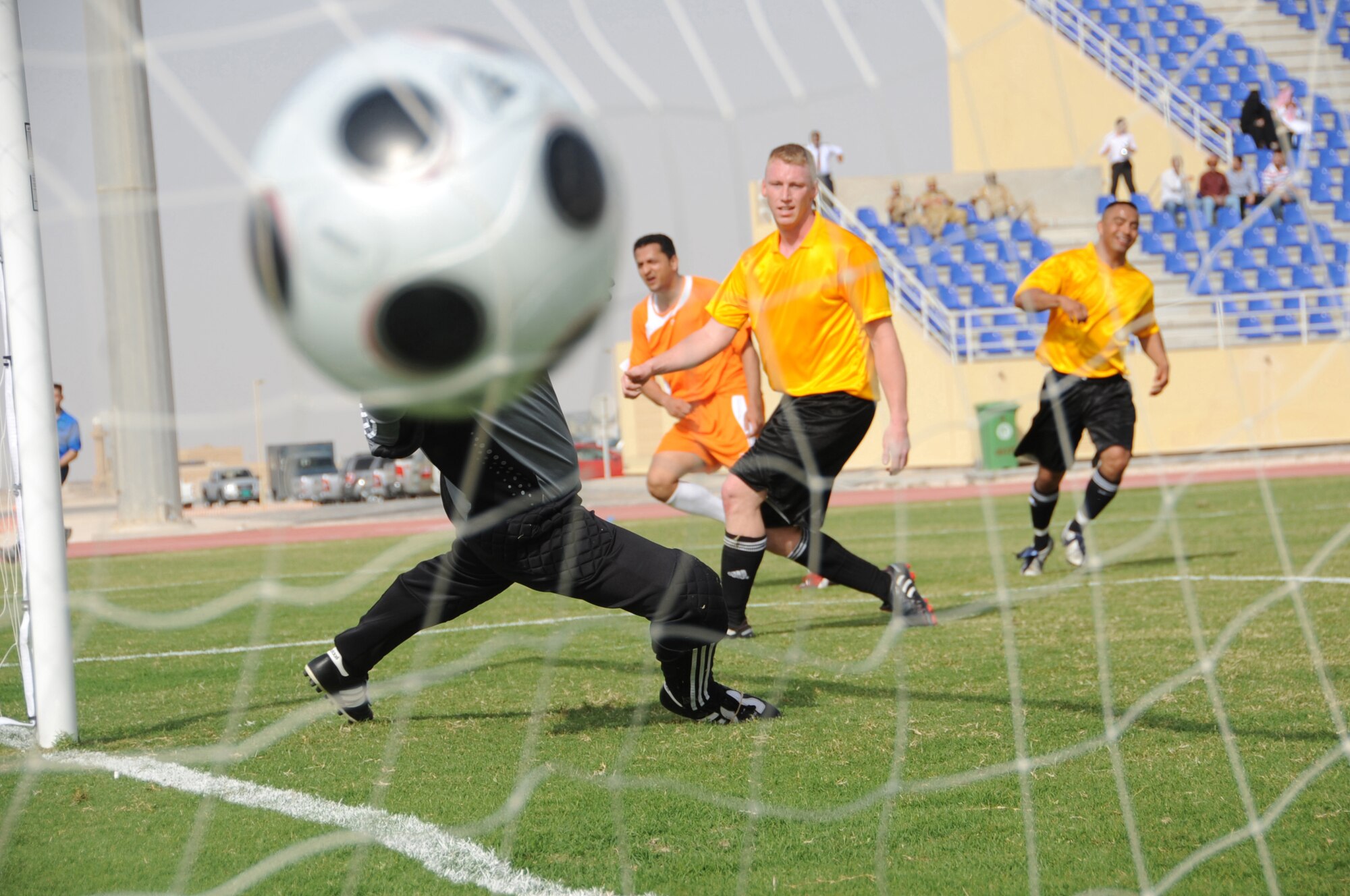 The host-nation team scores a goal against Coalition servicemembers during a high-speed soccer game at a non-disclosed Southwest Asia location, April 1, 2010. The host-nation team defeated the Coalition forces team by a score of 3-1. (U.S. Air Force photo by Tech. Sgt. Michelle Larche)[RELEASED]
