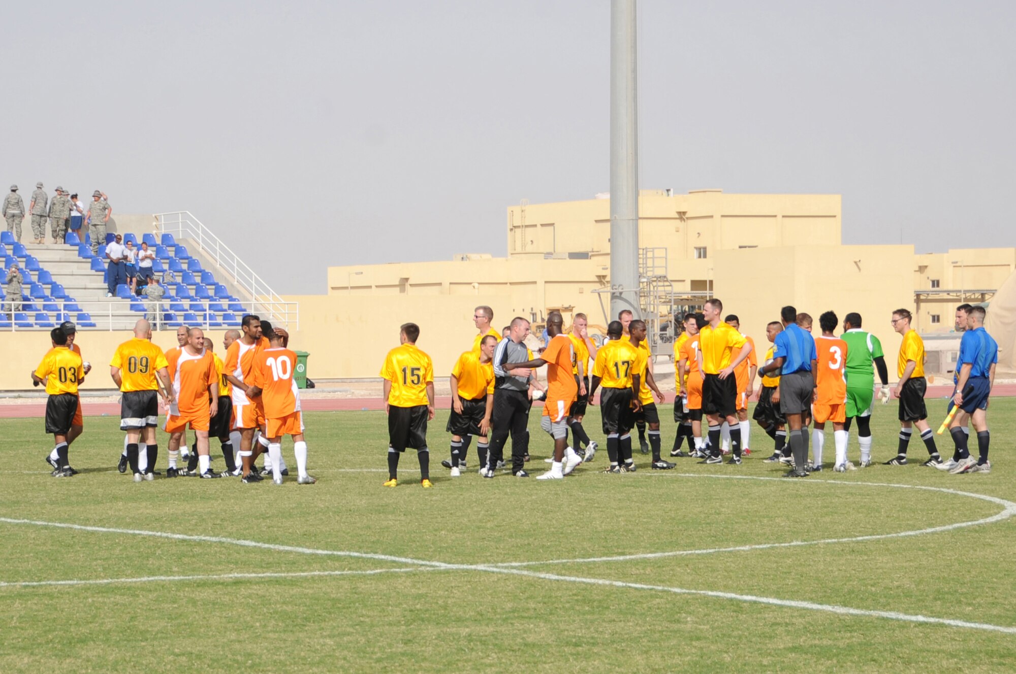 Host-nation and Coalition servicemembers shake hands after competing in a high-speed game of soccer with the host-nation defeating the Coalition by a score of 3-1 at a non-disclosed Southwest Asia location, April 1, 2010. (U.S. Air Force photo by Tech. Sgt. Michelle Larche)[RELEASED]