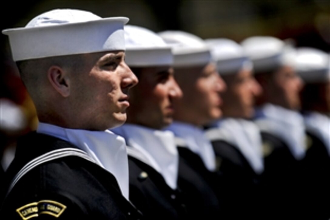U.S. Navy sailors assigned to the U.S. Ceremonial Guard stand at attention during a ceremony celebrating the 117th birthday of the chief petty officer rank at the U.S. Navy Memorial, Washington, April 1, 2010.