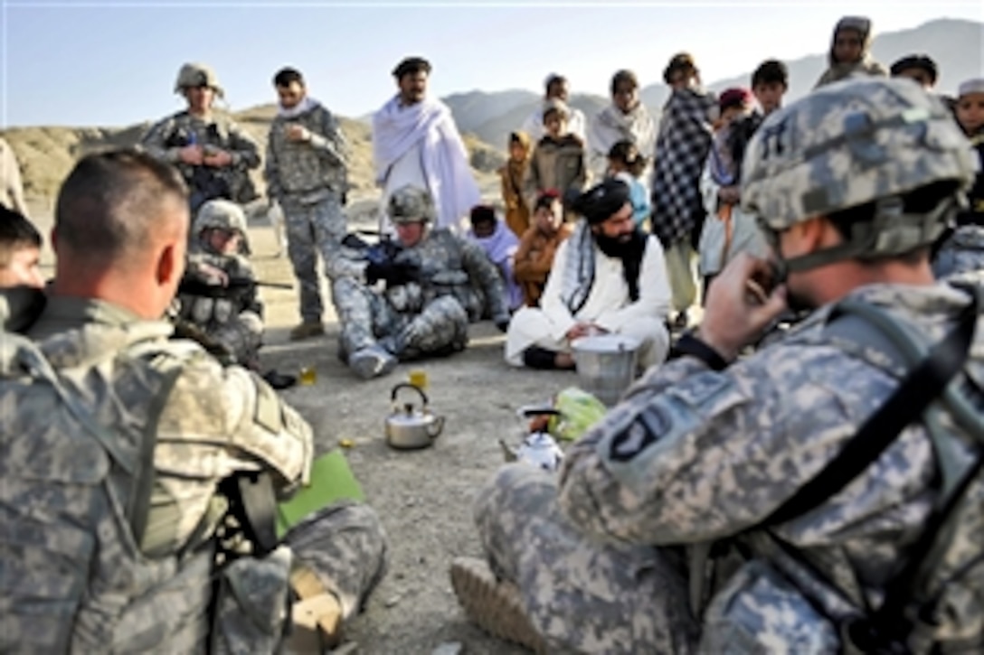 U.S. Army Staff Sgt. Arin Wilson and soldiers assigned to the Paktika Provincial Reconstruction Team's Orgun branch meet with village elders in Pirkoti in Afghanistan's Paktika province, March 26, 2010. Wilson, assigned to the 101st Airborne Division's Headquarters Company, 1st Battalion, 187th Infantry Regiment, 3rd Brigade Combat Team, was the information engagement non-commissioned officer in charge. U.S. and Afghan soldiers met with residents to learn about their needs.