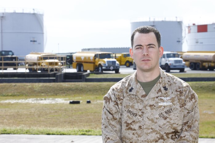 Petty Officer 1st Class Kemp Dreher, staff noncommissioned officer-in-charge of station fuels, stands in front of the large fuel tanks at station fuels. Dreher has served in the Navy since 1996 and is on his second tour in Japan, where he was just named Marine Forces Pacific Shore Sailor of the Year.