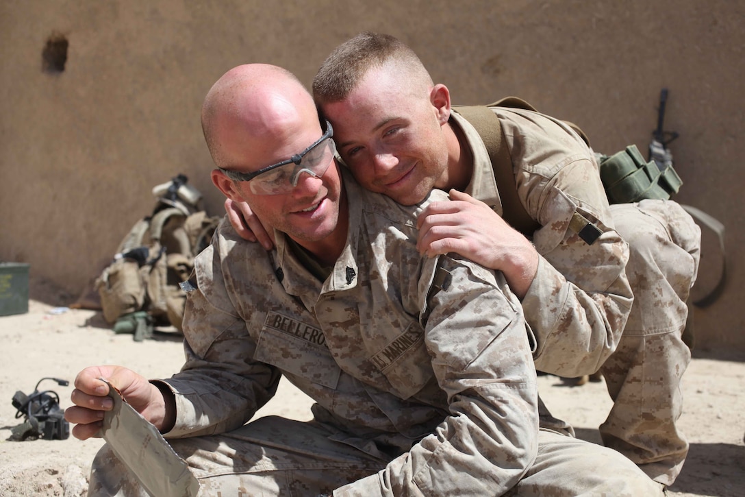 U.S. Marine Sgt. Bellrose with 4th Platoon, Charlie Company, 1st Battalion 2nd Marines shares jokes with his fellow Marines over a Meal-Ready to-Eat after conducting security patrols April 3, 2010.  Marines with 1/2 are conducting combat operations in the Helmand Providence in support of Operation Enduring Freedom.  (Official Marine Corps photo by Sgt Sean Baldwin)