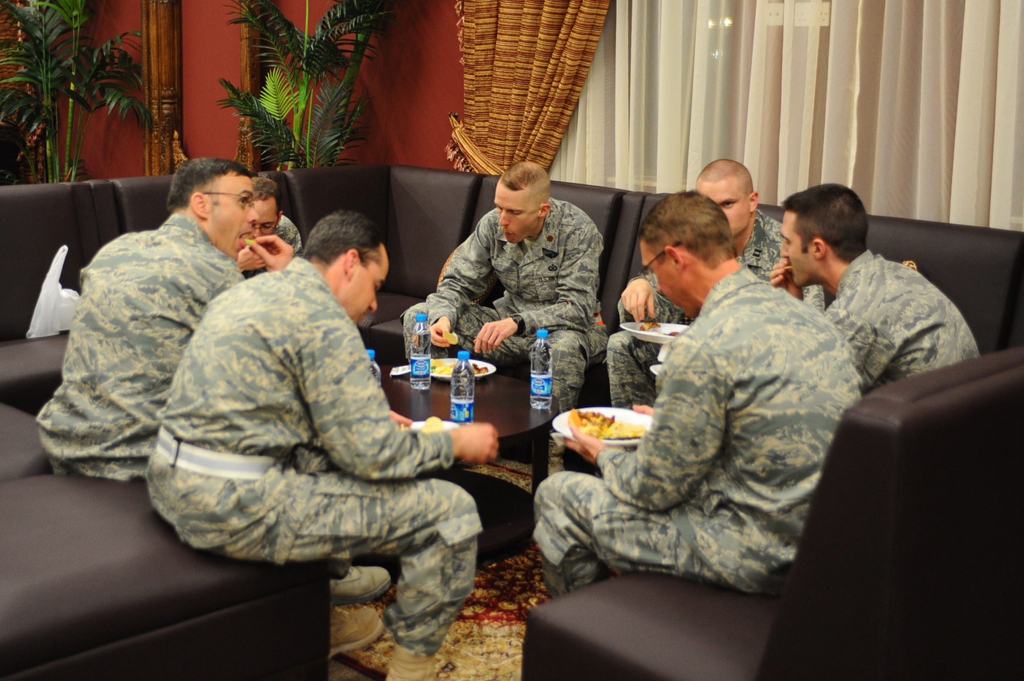 Officers enjoy snacks at the grand opening of the Kasbah Officers' Lounge at a non-disclosed Southwest Asia location March 26, 2010. (U.S. Air Force photo by Senior Airman Kasey Zickmund)[RELEASED]