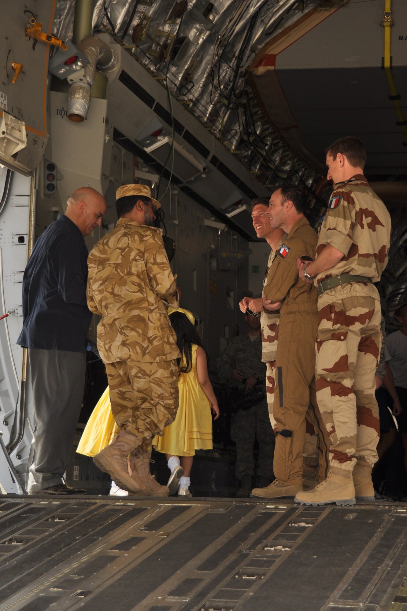 A host-nation member talks to French Coalition partners during Air Fest '10 at a non-disclosed Southwest Asia location April 1, 2010. (U.S. Air Force photo by Capt. Patrick Cordova)[RELEASED]