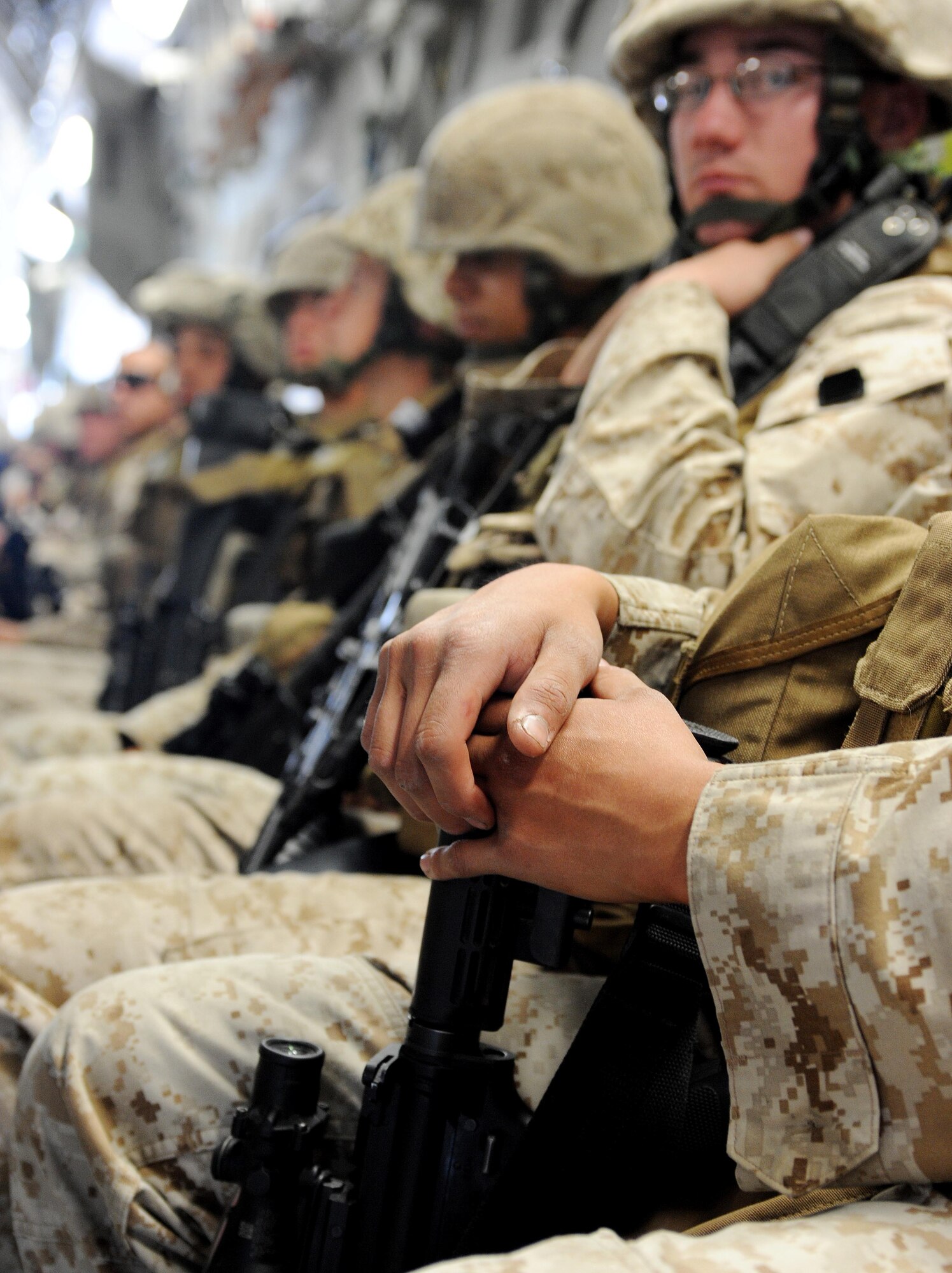 Marines from the 7th Engineer Support Battallion, Marine Corps Base Camp Pendleton, Calif.,  load onto a C-17 Globemaster III at the Transit Center at Manas, Kyrgyzstan, en route to Afghanistan, after spending a couple of days in transit here April 2, 2010. Thousands of Marines, Soldiers, Airman and coalition troops transit through here each month in support of Operation Enduring Freedom. In March the 376th Expeditionary Logistics Readiness Squadron set a record, pushing through 50,000 multi-national, U.S. and coalition troops.  (U.S. Air Force photo/Senior Airman Nichelle Anderson/released)