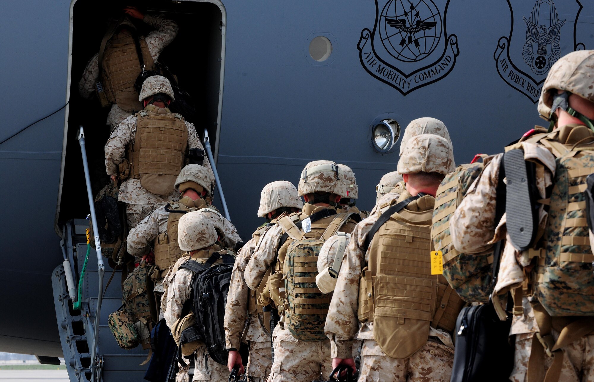Marines from the 7th Engineer Support Battallion, Marine Corps Base Camp Pendleton, Calif.,  load onto a C-17 Globemaster III at the Transit Center at Manas, Kyrgyzstan, en route to Afghanistan, after spending a couple of days in transit here April 2, 2010. Marines, Soldiers and Airman transit through here each month in support of Operation Enduring Freedom. In March, the 376th Expeditionary Logistics Readiness Squadron set a record, pushing through 50,000 multi-national troops. (U.S. Air Force photo/Senior Airman Nichelle Anderson/released)