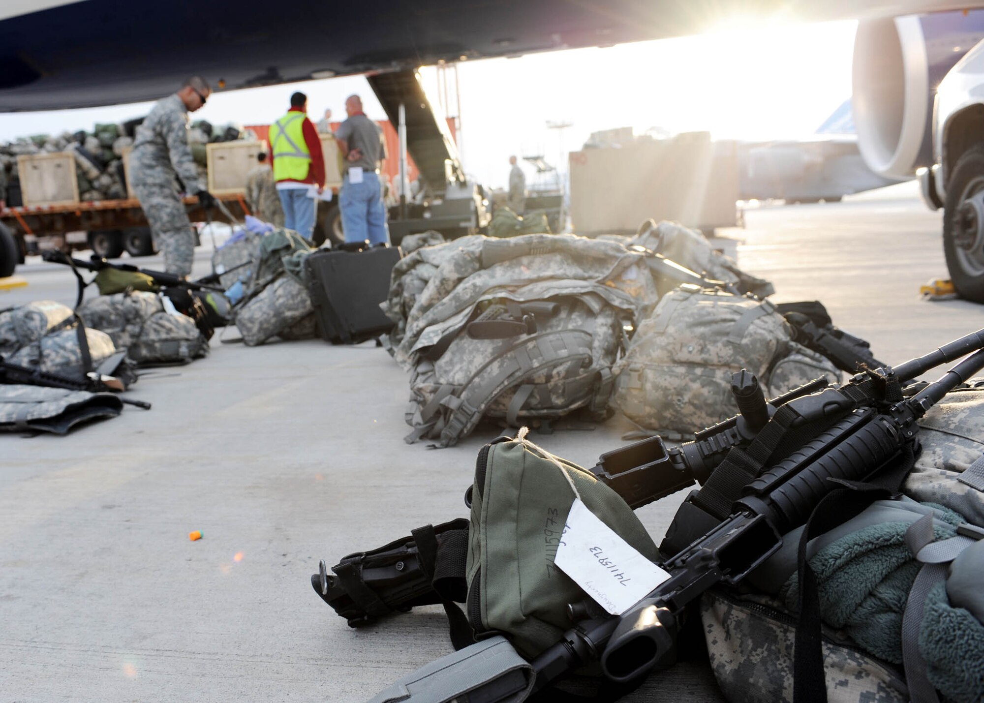 Baggage arrive at the flight line at the Transit Center at Manas, Kyrgyzstan, before being sent downrange with Soldiers from the 557th Engineer Company, 864th Engineer Battalion, Ft. Lewis, Wash. The passenger terminal set two records in March pushing through 50,000, U.S. and coalition troops, and the petroleum, oil and lubricants flight issued 12,500,102 gallons of jet fuel in March. (U.S. Air Force photo/Senior Airman Nichelle Anderson/released)