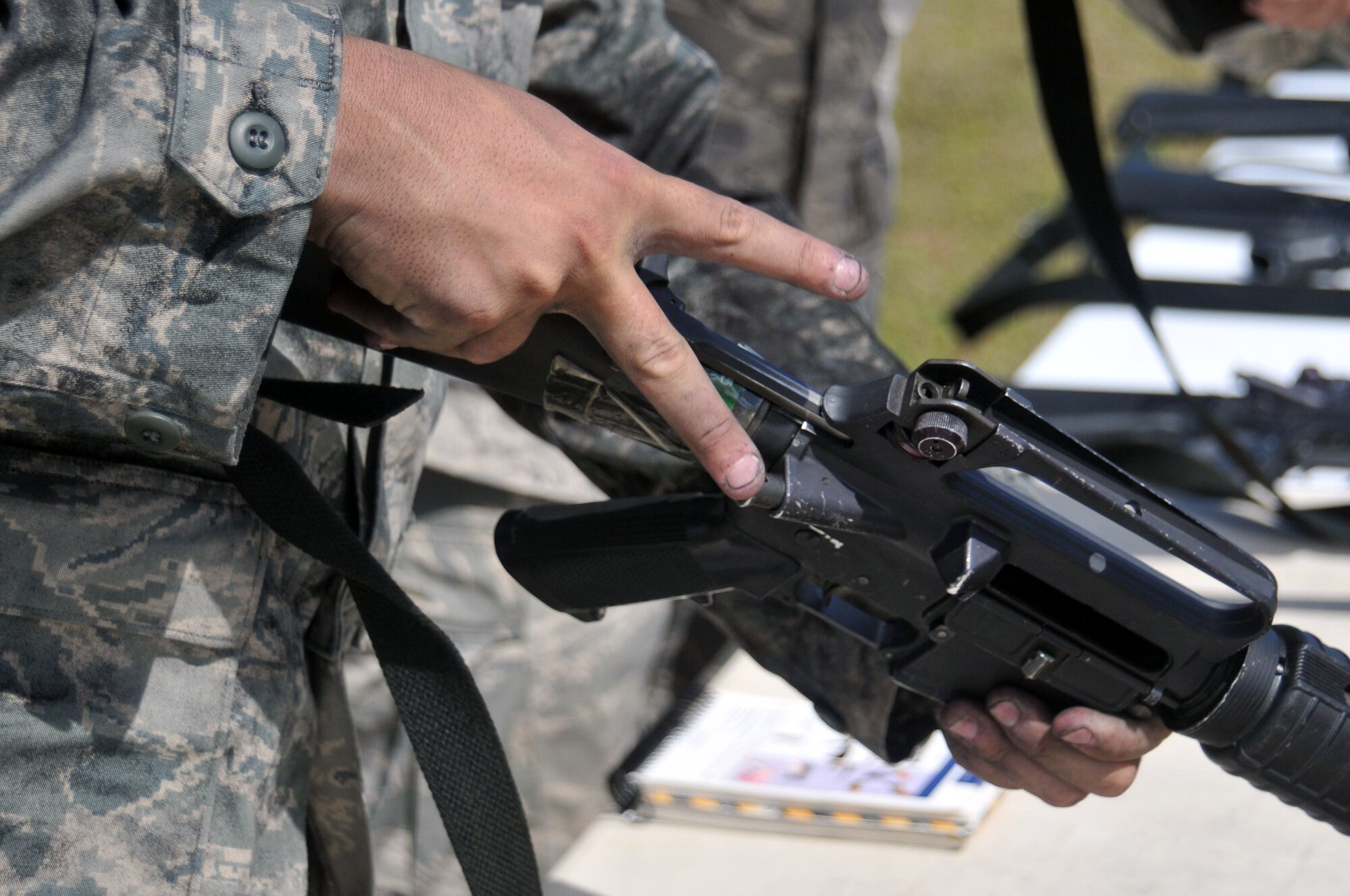 ANDERSEN AIR FORCE BASE, Guam - With an Operational Readiness Inspection rapidly approaching, the 36th Wing participated in a wing-wide Ability to Survive and Operate "Rodeo" here March 30, 2010. The training differed from previous rodeos in that it was not set up in a circuit format. Instead, both chalks were divided down into approximately five groups. Each group was assigned a sector which included a tent, water supply and some sort of vehicle. Once split into the groups all the sectors had to respond simultaneously and accordingly to the scenarios as they were inserted into the scenario. Areas of focus ranged from decontamination, transition points, chemical gear wear check, self-aid and buddy care, unexploded ordnance, land-mobile radio, and also M-16. Throughout the rodeo exercise evaluation team members graded the participants on every aspect of their performance.  (U.S. Air Force photos by Airman 1st Class Julian North)

