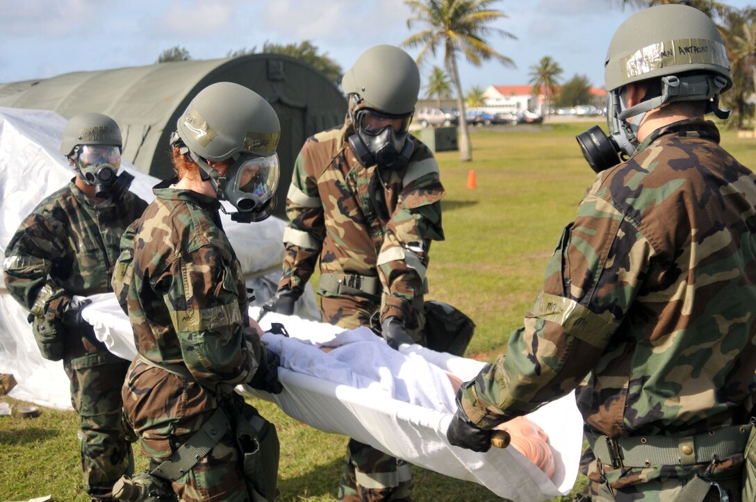 ANDERSEN AIR FORCE BASE, Guam - Participants in the Wing Abilitiy To Survive and Operate Rodeo carry a simulation casualty here March 30 2010. Partcipants in the rodeo took part in several exercises to include PAR sweeps, decontamination, and M-16 disassembly and reassembly.