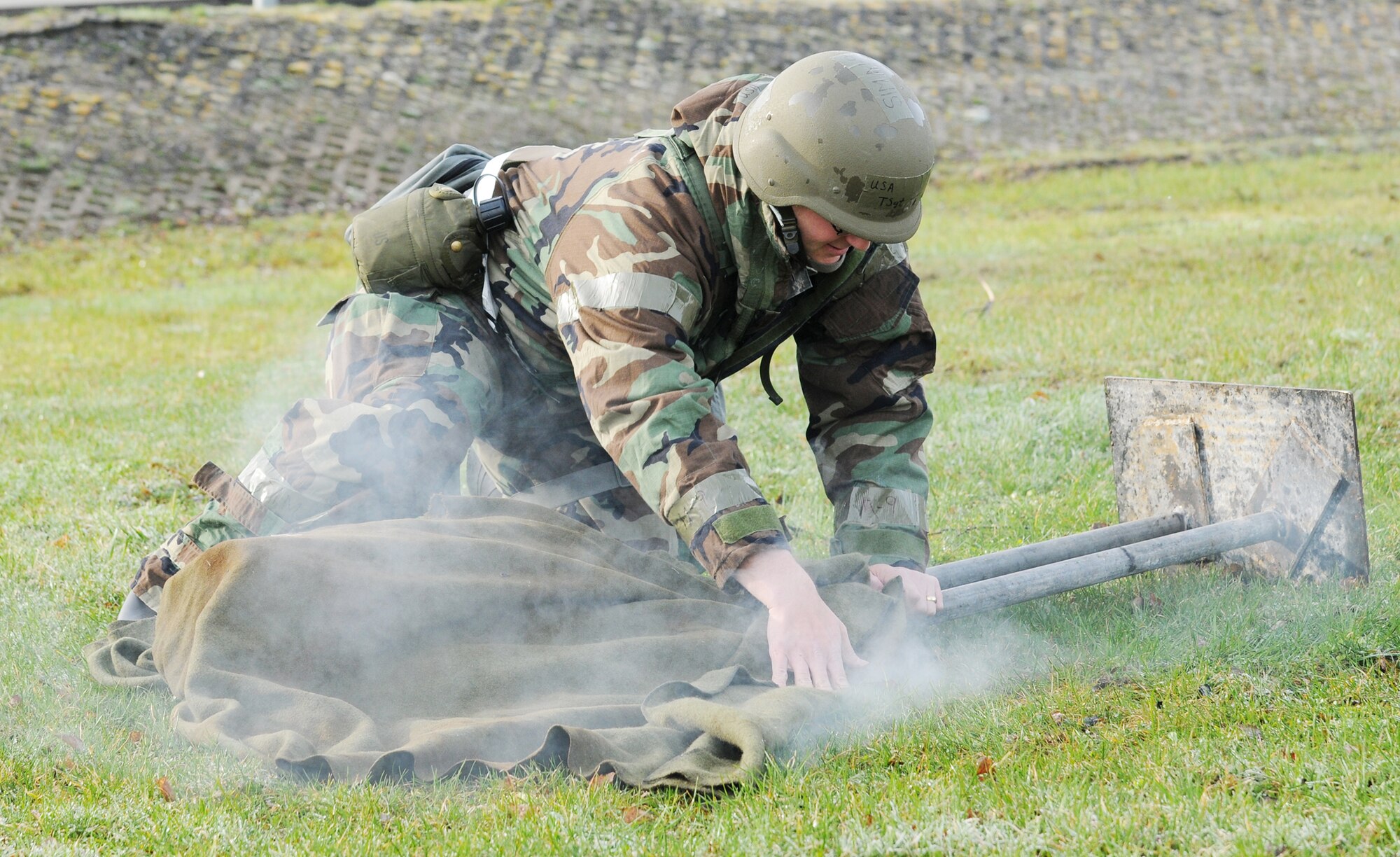 Tech. Sgt. Christopher Thompson extinguishes a burning dummy during individual core competency skills training April 2, 2010 at Spangdahlem Air Base, Germany. The training reviewed  various skills to prepare active participants in the NATO Force Evaluation this summer. Sergeant Thompson is the emergency action controller with the 52nd Fighter Wing Command Post. (U.S. Air Force photo/Senior Airman Nathanael Callon)