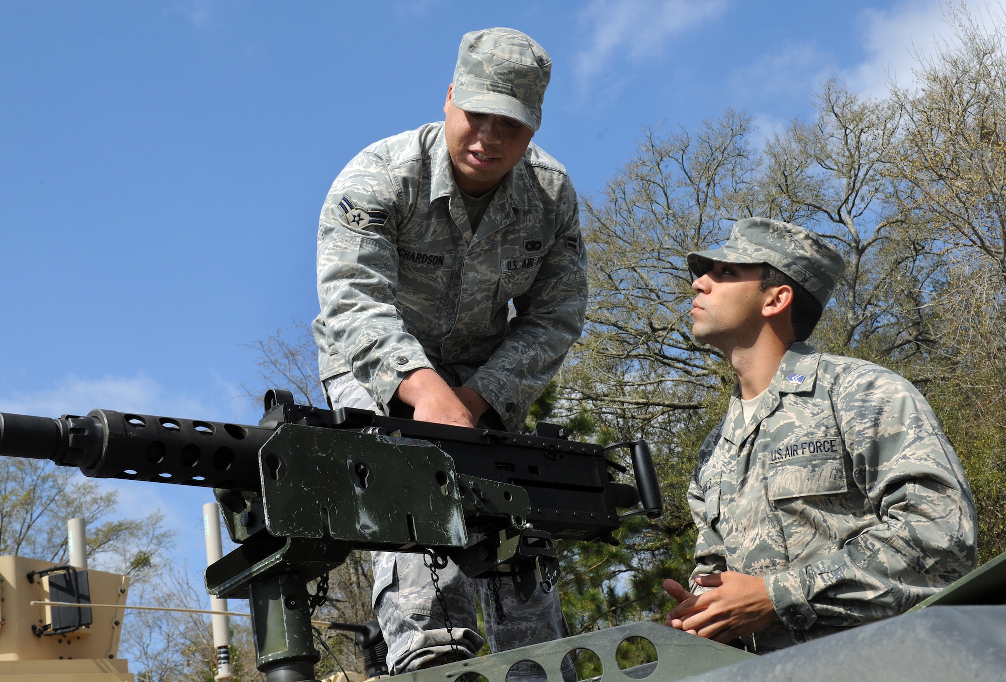 Airman 1st Class Kevin Richardson shows the M-2 heavy machine gun to Cadet 3rd Class Rolando Perez March 23, 2010, at Moody Air Force Base, Ga. Airman Richardson is a 823rd Security Forces Squadron fire team member, and Cadet Perez is from the University of Puerto Rico Air Force ROTC Detachment 755.. (U.S. Air Force photo/Airman 1st Class Benjamin Wiseman)