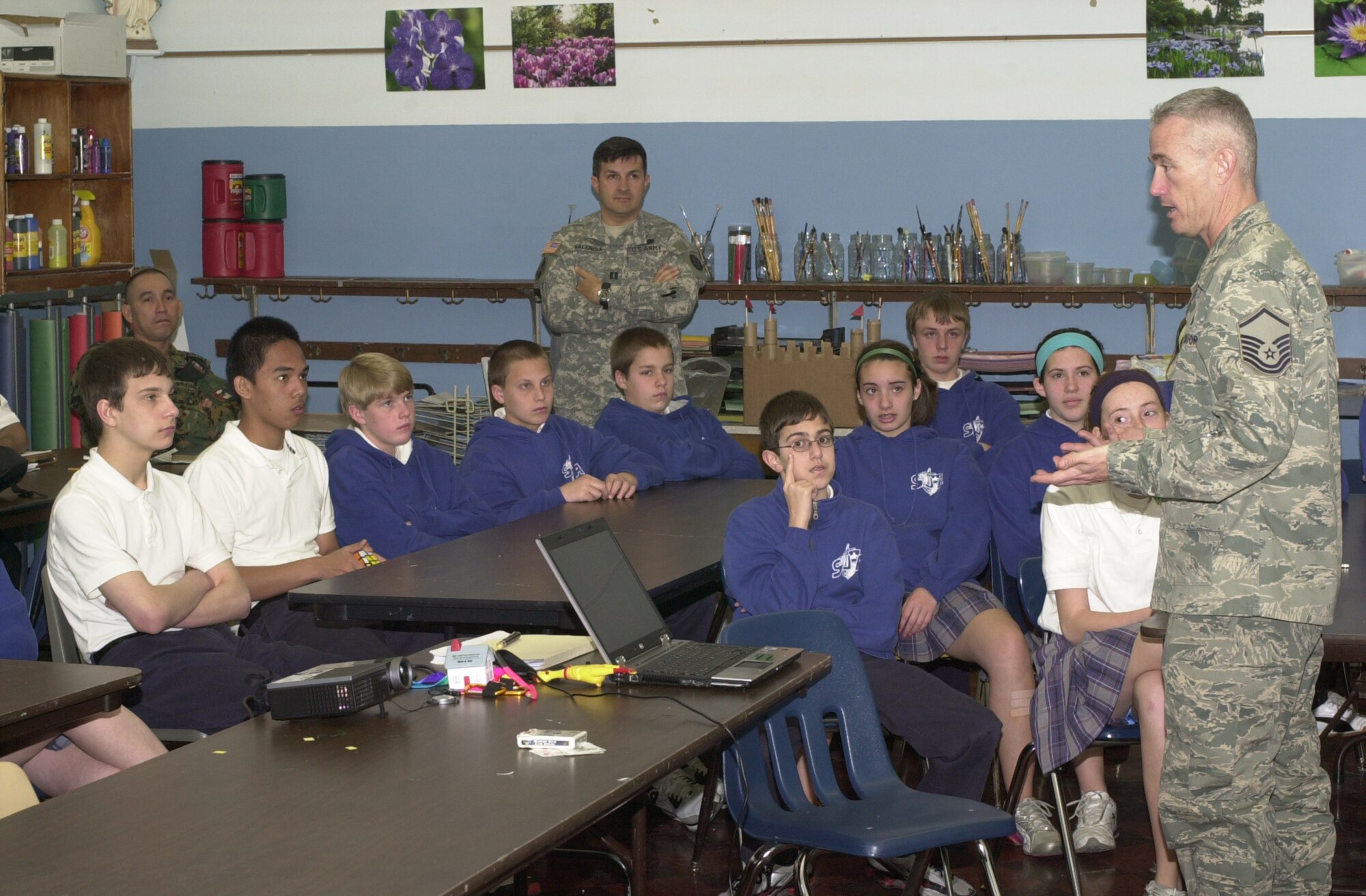 Master Sgt. Curtis Hanock, 131st Logistics Readiness Squadron and Counterdrug Task Force member, speaks to the children at St. Joan of Arc School about the dangers of drugs, alcohol and tobacco.  Members of the Panamanian National Police and the Frontier Force visited the Missouri National Guard CDTF to learn new techniques to present to at-risk children in Panama. (Photo by Bill Phelan)