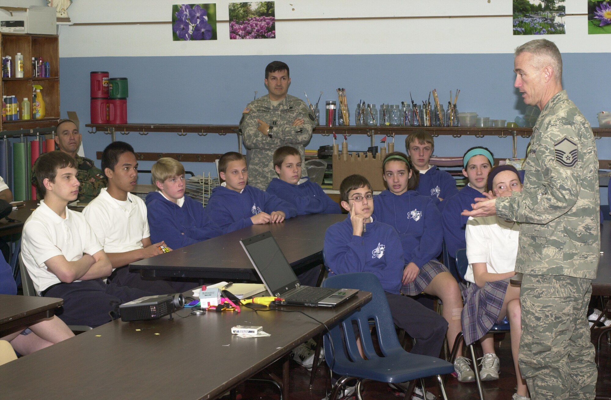 Master Sgt. Curtis Hanock, 131st Logistics Readiness Squadron and Counterdrug Task Force member, speaks to the children at St. Joan of Arc School about the dangers of drugs, alcohol and tobacco.  Members of the Panamanian National Police and the Frontier Force visited the Missouri National Guard CDTF to learn new techniques to present to at-risk children in Panama. (Photo by Bill Phelan)