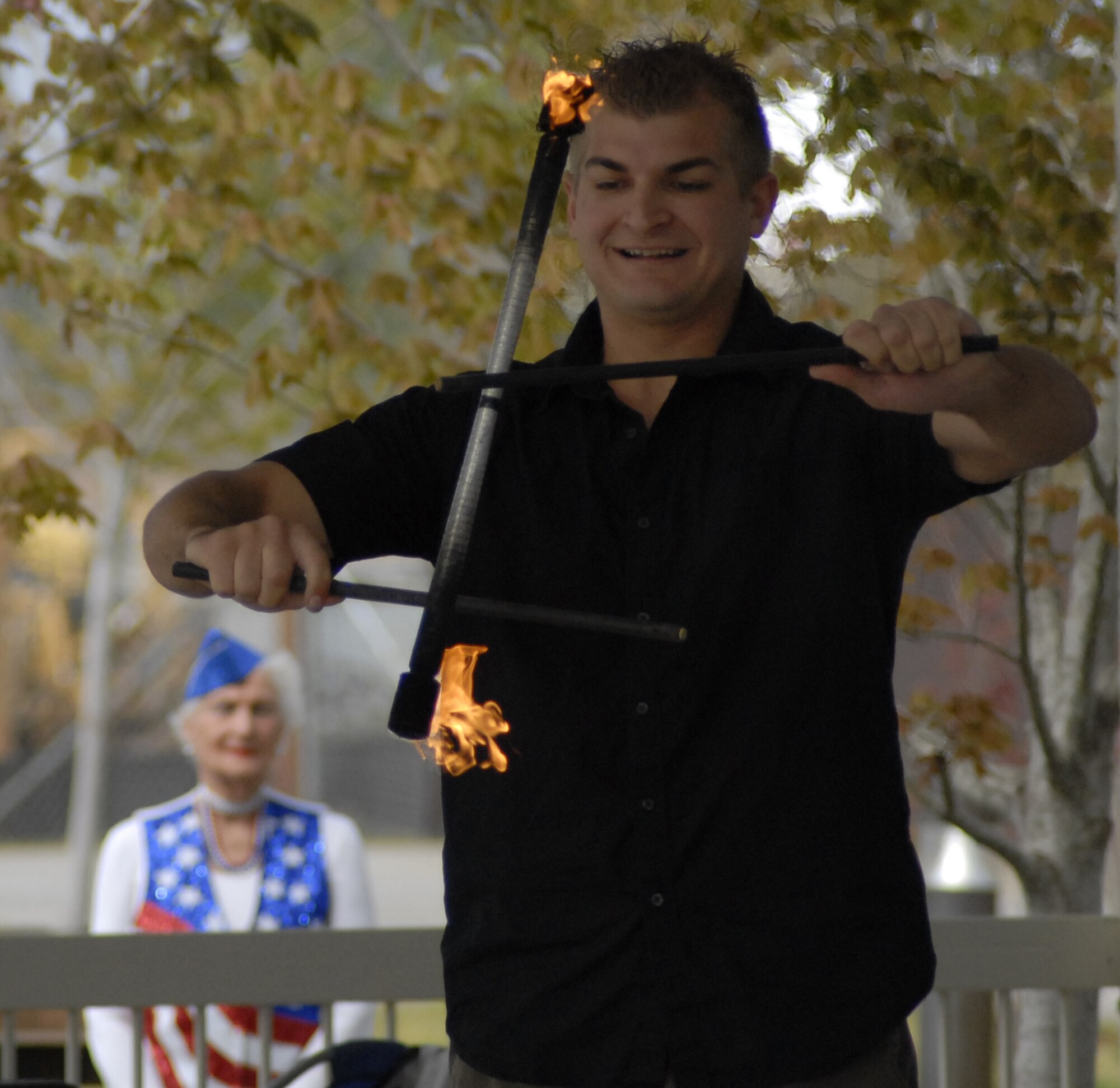 Capt. Stephen Lanzola, 4th Special Operations Squadron, juggles a torch between two sticks at the tenth annual Family Fest and Egg Hunt at the Hurlburt Field Community Park April 3. The event was coordinated by the 1st Special Operations Force Support Squadron and sponsoring agencies for family entertainment during the holiday weekend. (U.S. Air Force photo by Airman 1st Class Joe McFadden)