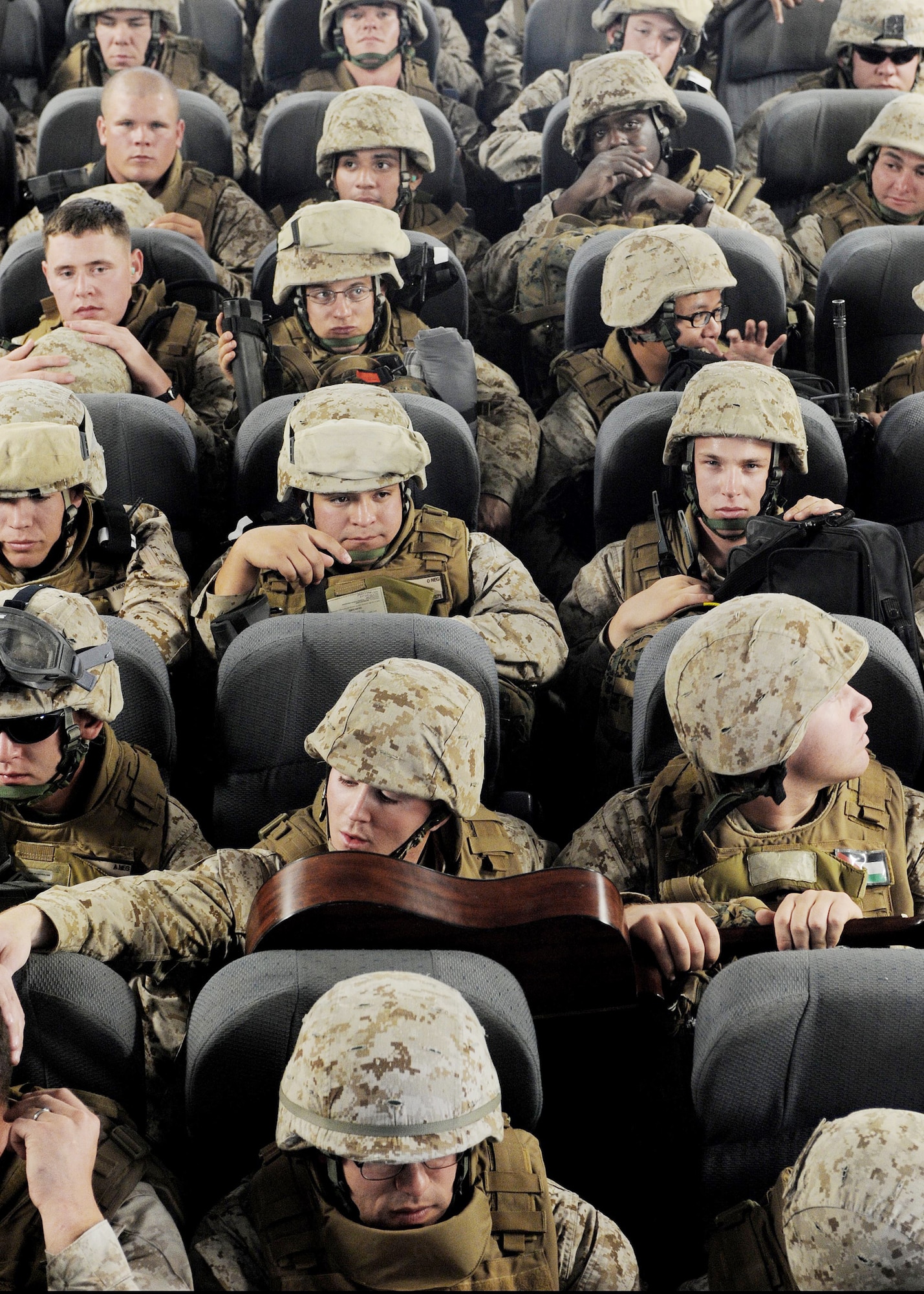 Marines sit on a C-17 Globemaster III en route to Afghanistan April 2, 2010 at the Transit Center at Manas, Kyrgyzstan. Thousands of Marines, Soldiers, Airmen and coalition troops transit through here each month in support of Operation Enduring Freedom. In March, 376th Expeditionary Logistics Readiness Squadron Airmen pushed through 50,000 multinational, U.S. and coalition troops. The Marines are from the 7th Engineer Support Battalion, Marine Corps Base Camp Pendleton, Calif. (U.S. Air Force photo/Senior Airman Nichelle Anderson)