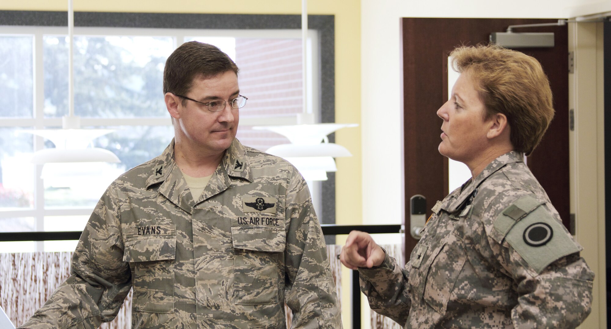 Col. Rob Evans welcomes Brig. Gen. Heidi Brown during her visit to the 1st Air Support Operations Group and the 5th Air Support Operations Squadron March 30, 2010, at Joint Base Lewis-McChord, Wash. Colonel Evans is the I-Corps air liaison officer and the 1st ASOG commander. General Brown is the I-Corps deputy commanding general for sustainment and the senior air defense officer. (U.S. Army photo)