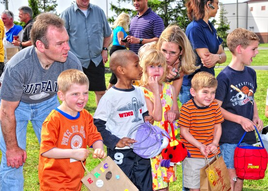 Members of the 914th and 107th Airlift Wings and their families participate in the Children?s Easter Egg Hunt at the Niagara Falls Air Reserve Station, April 3, 2010, Niagara Falls NY. The egg hunt was held behind the Falcons Club where candy filled plastic eggs where hidden for the children to find. (U.S. Air Force photo by Staff Sgt. Joseph McKee)